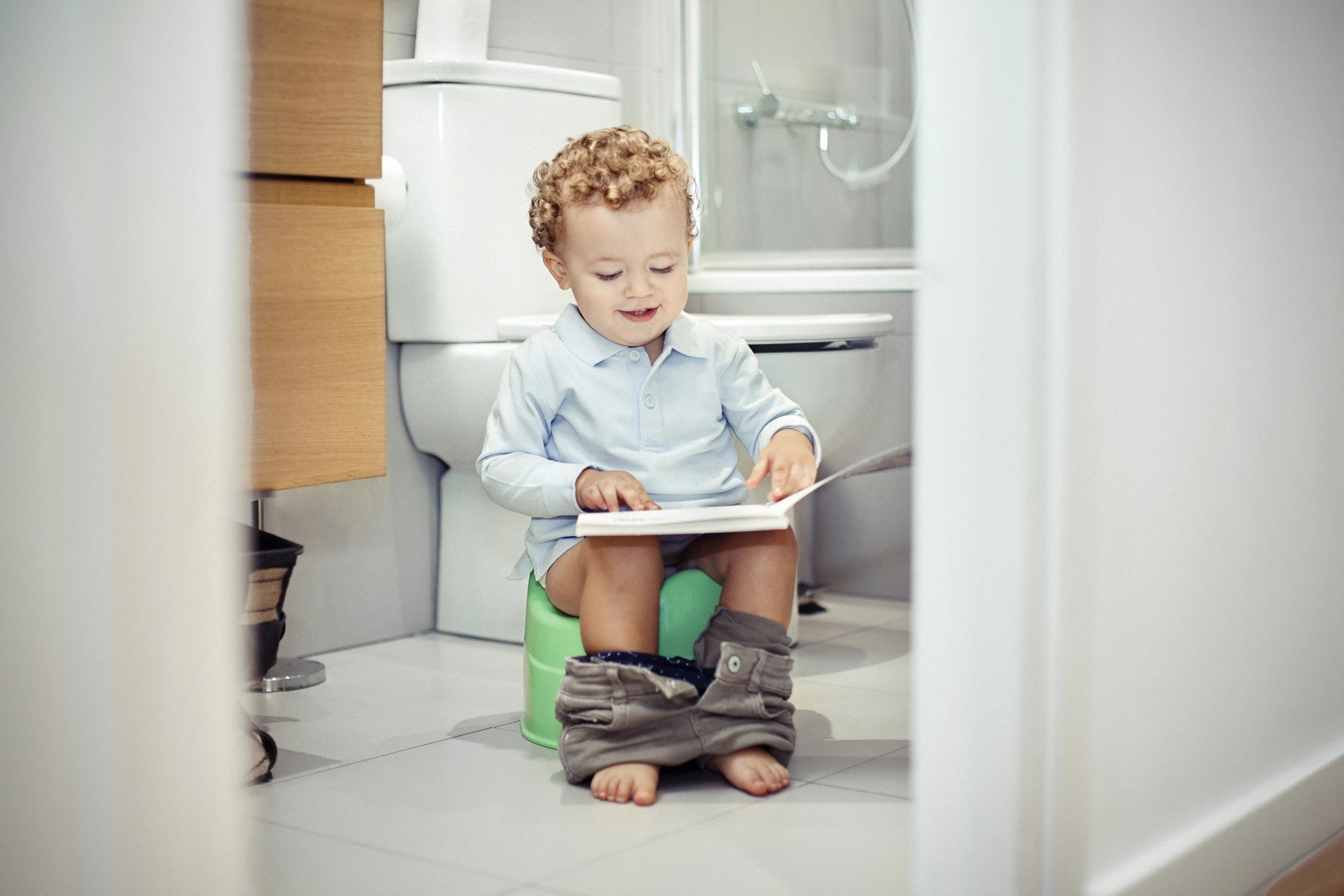 Child sitting on the toilet