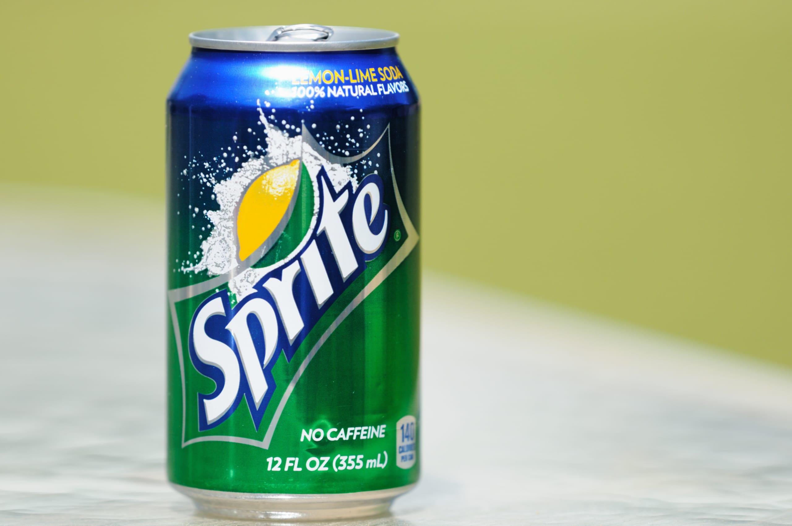 Northport, Alabama, USA - April 13, 2011: Close up of Sprite soda can in horizontal composition with out of focus background and copy space. Aluminum can sitting on glass table.
