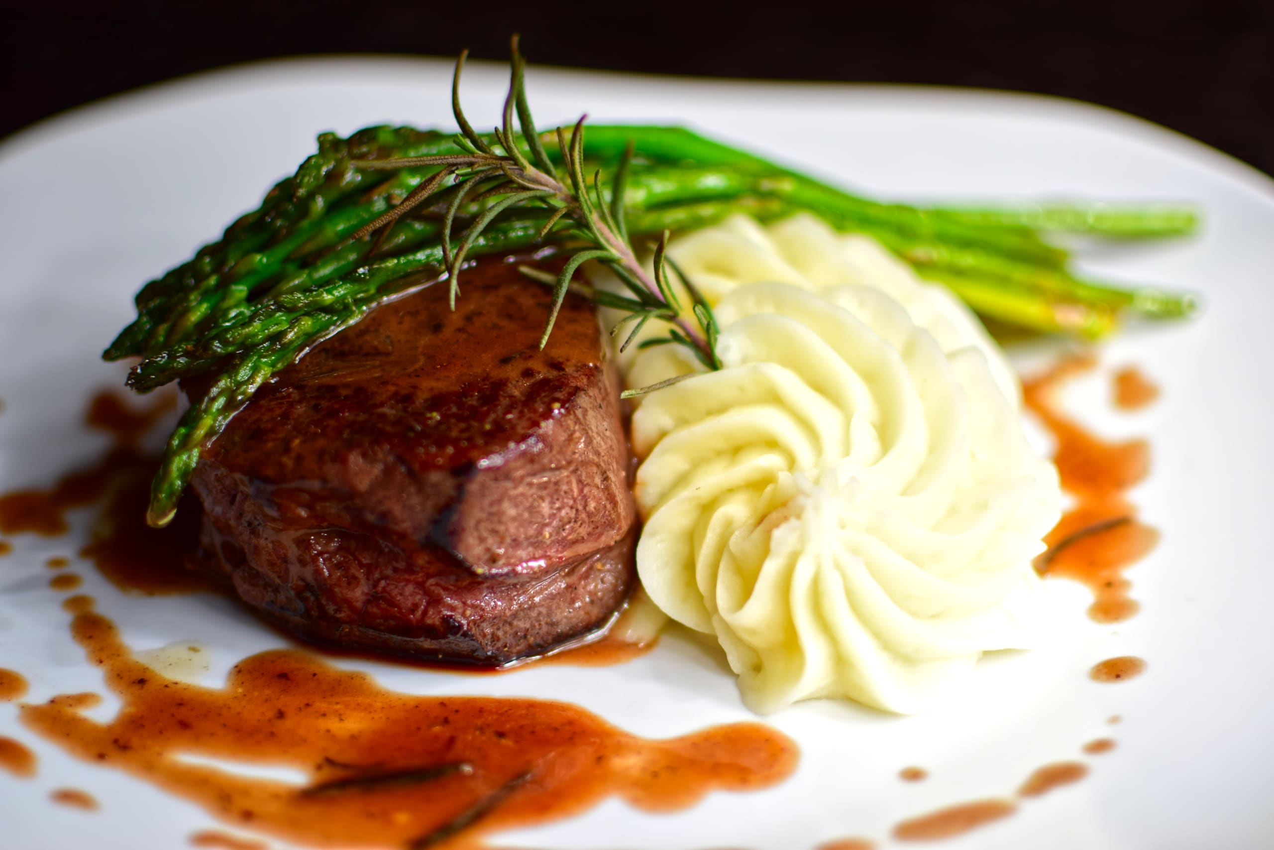 Sous vide filet mignon with truffled mashed potatoes, sauteed asparagus and a buerre rouge.