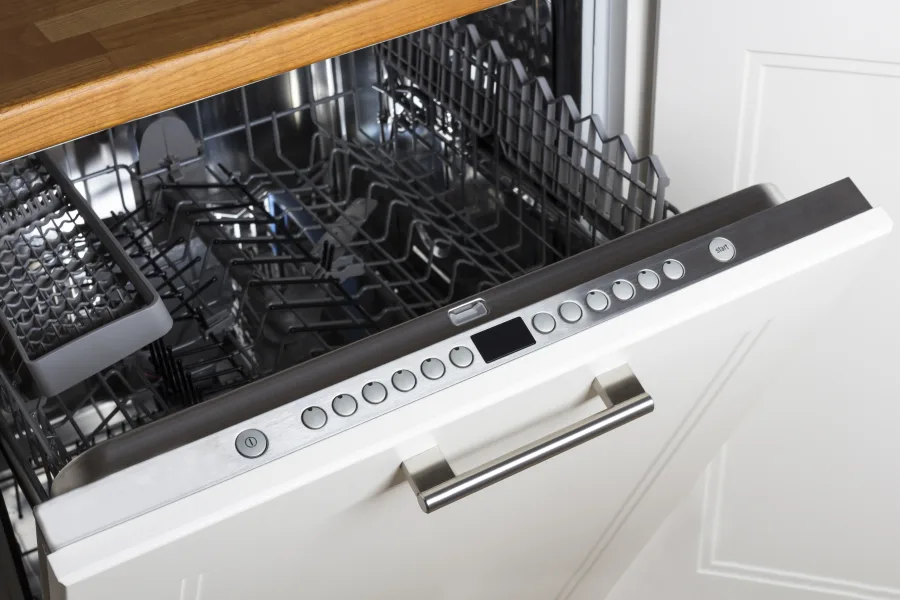 modern Half open empty dishwasher in a modern kitchen