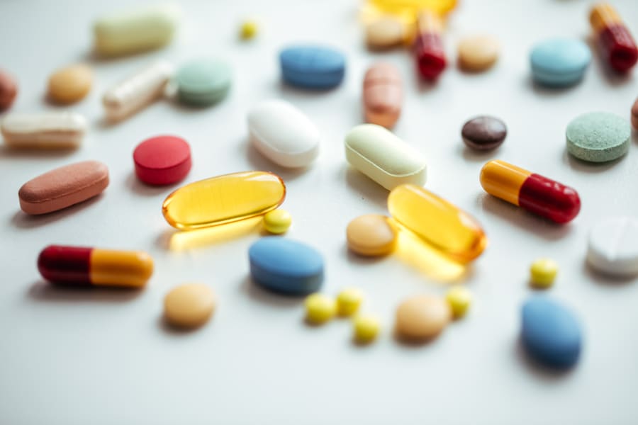 Pills on blue table