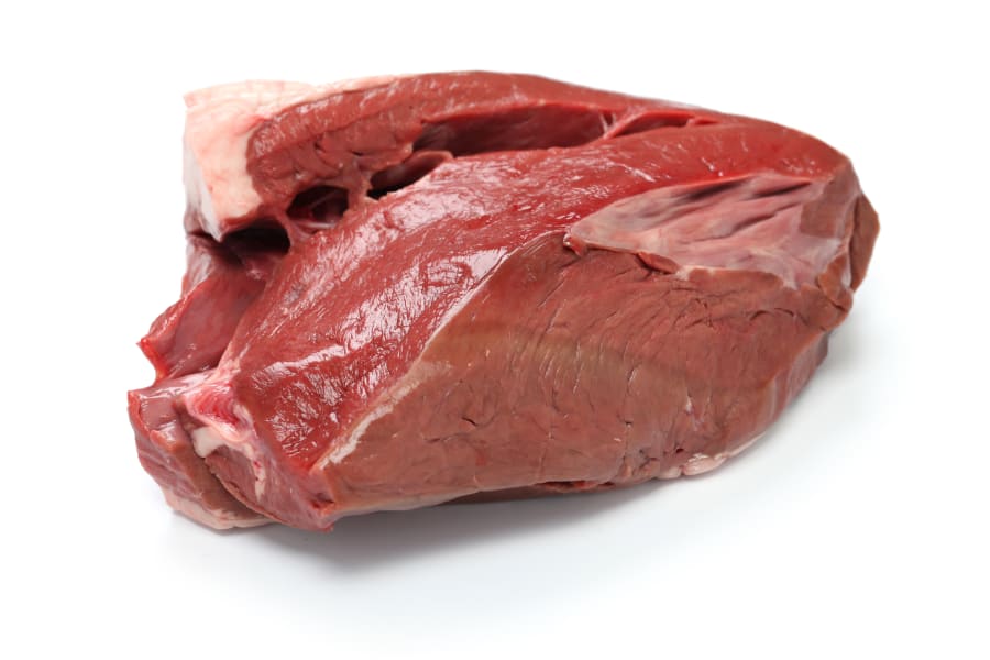 raw beef heart meat isolated on white background