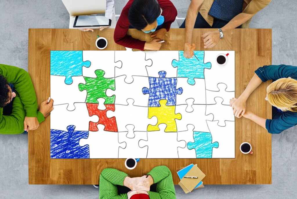 Puzzle pieces forming a picture of diverse people collaborating on a decision