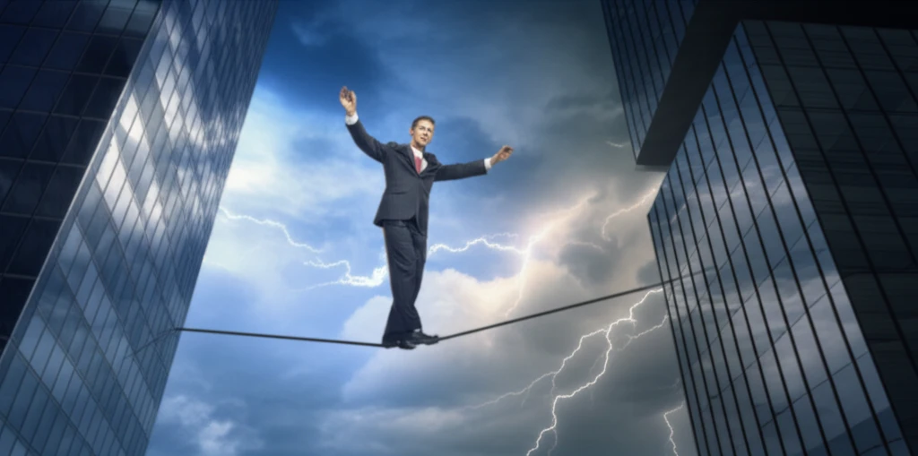 Business person balancing on a tightrope, symbolizing financial risk management.