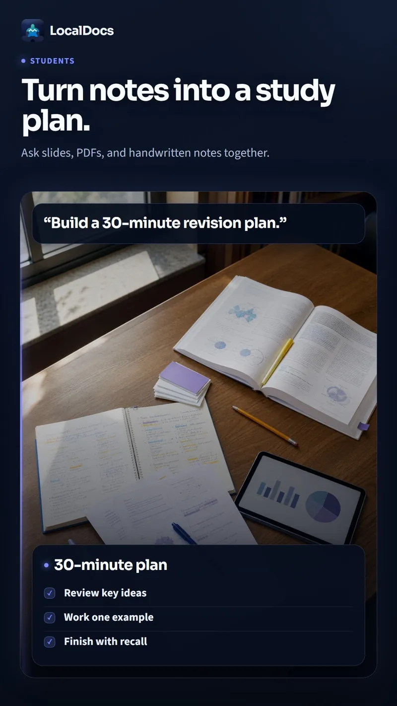 Two students sitting together revising from lecture notes, PDFs and a textbook