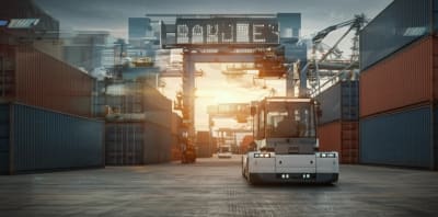 Automated guided vehicles transporting containers in a futuristic port.
