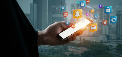Person holding a smartphone surrounded by location icons, cityscape background.