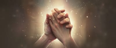 Hands intertwined, symbolizing the bond between a caregiver and a person with dementia.