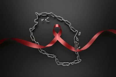 Chains forming Tanzania silhouette, symbolizing fight against human trafficking with red ribbon for HIV/AIDS awareness.