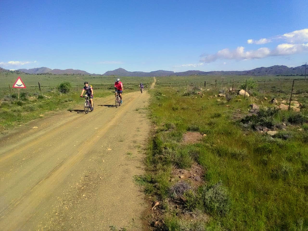 cycling along a dirt road in the karoo