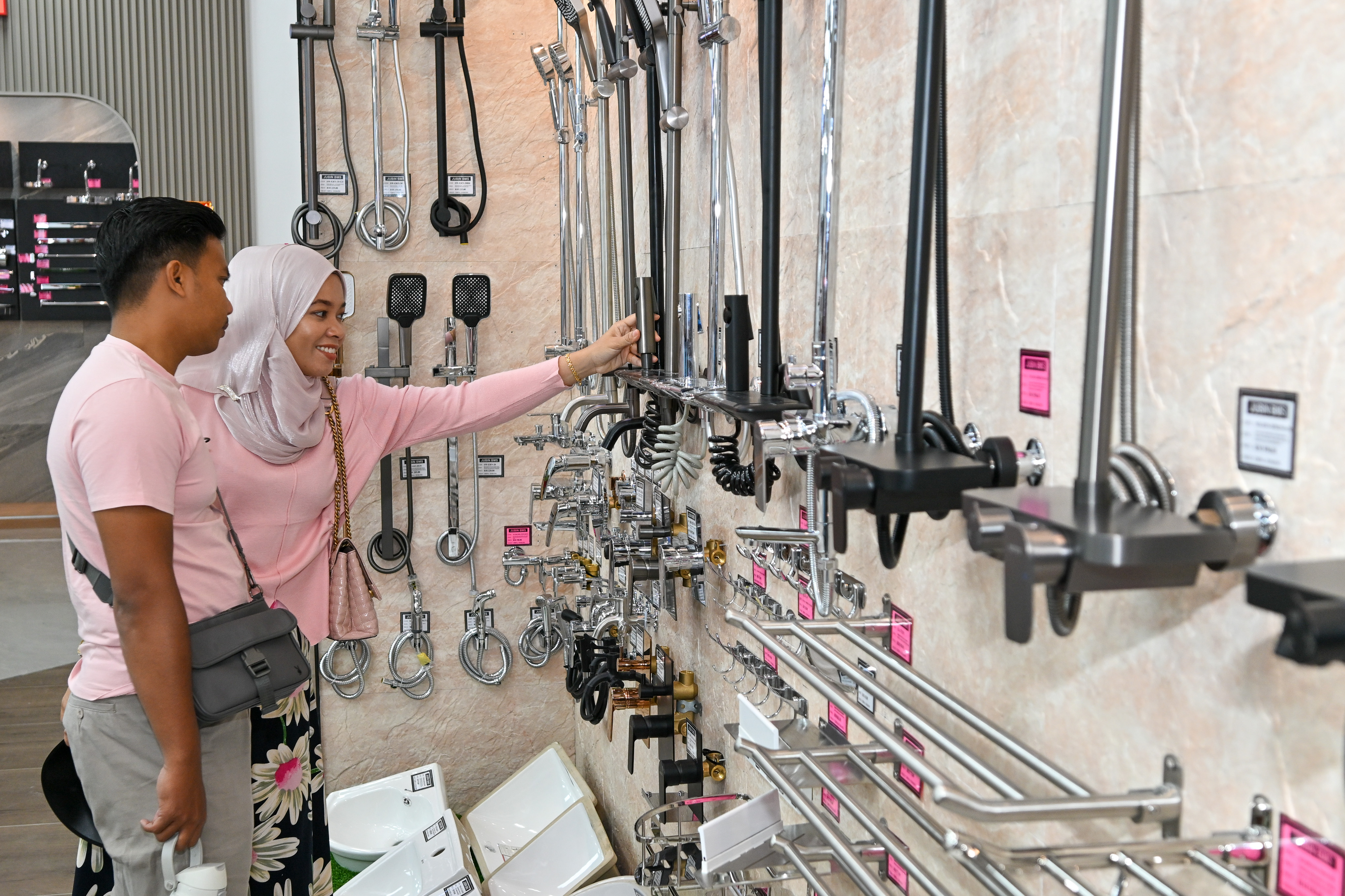 Customer selecting tiles and sanitary ware products at Jubin BMS Puchong Kinrara showroom