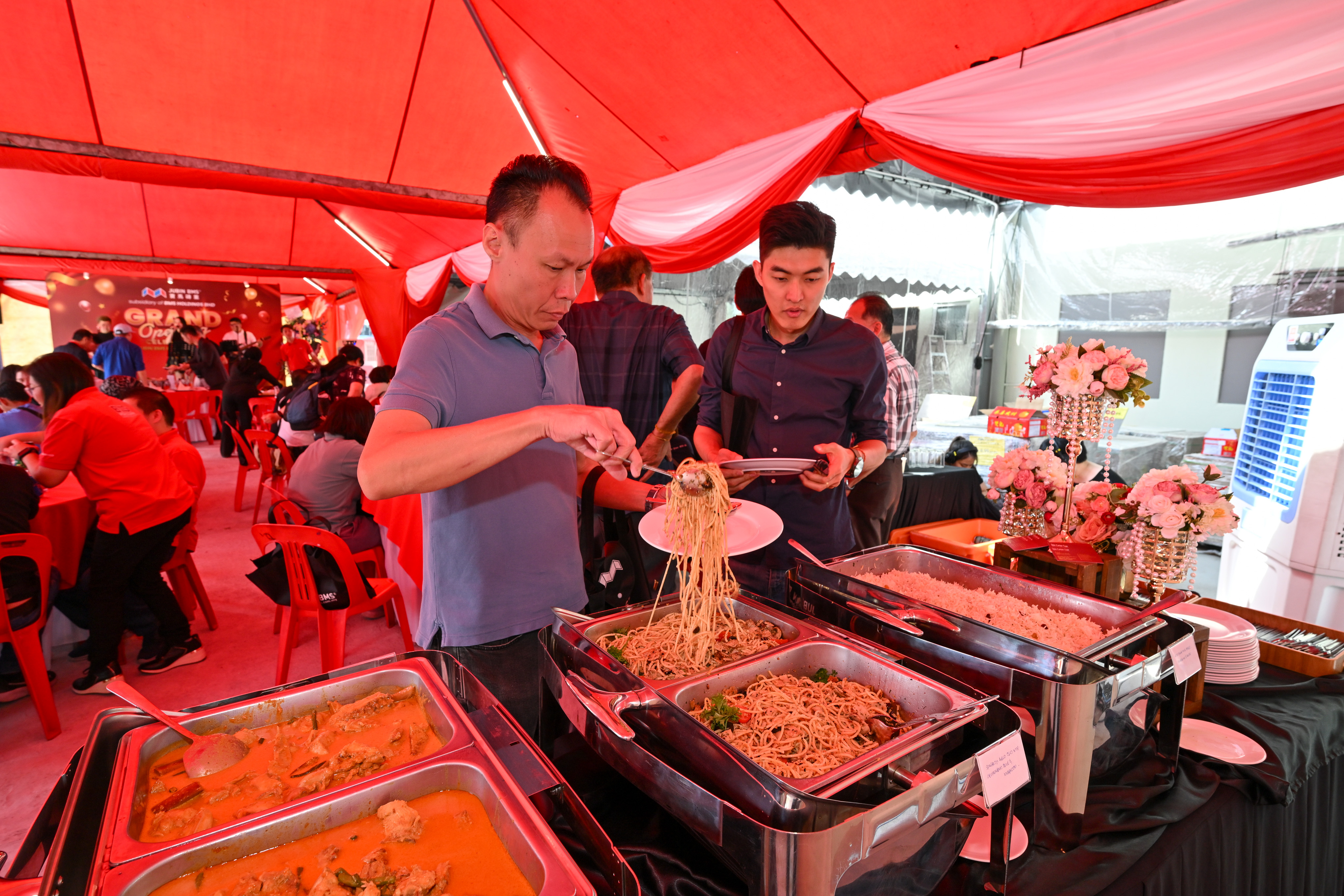 Visitors enjoying refreshments at the Jubin BMS Puchong Kinrara grand opening event