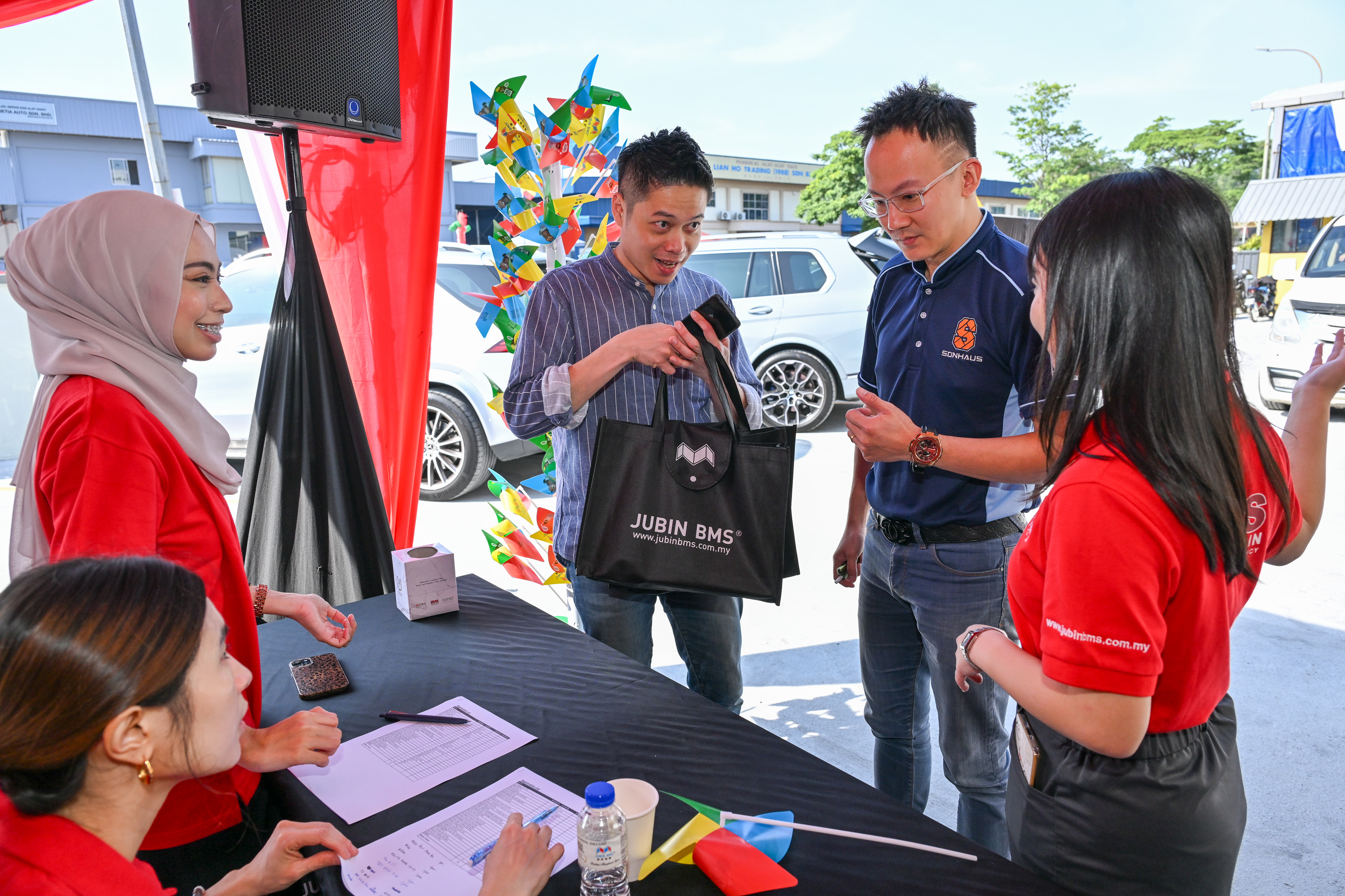 Guests registering at the entrance of Jubin BMS Puchong Kinrara grand opening event