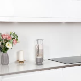 White Glass Kitchen Worktop with coffee, hob, baking and flowers