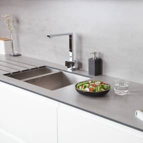 Concrete Solid Laminate Worktop in white kitchen with salad bowl on top of surface with other accessories