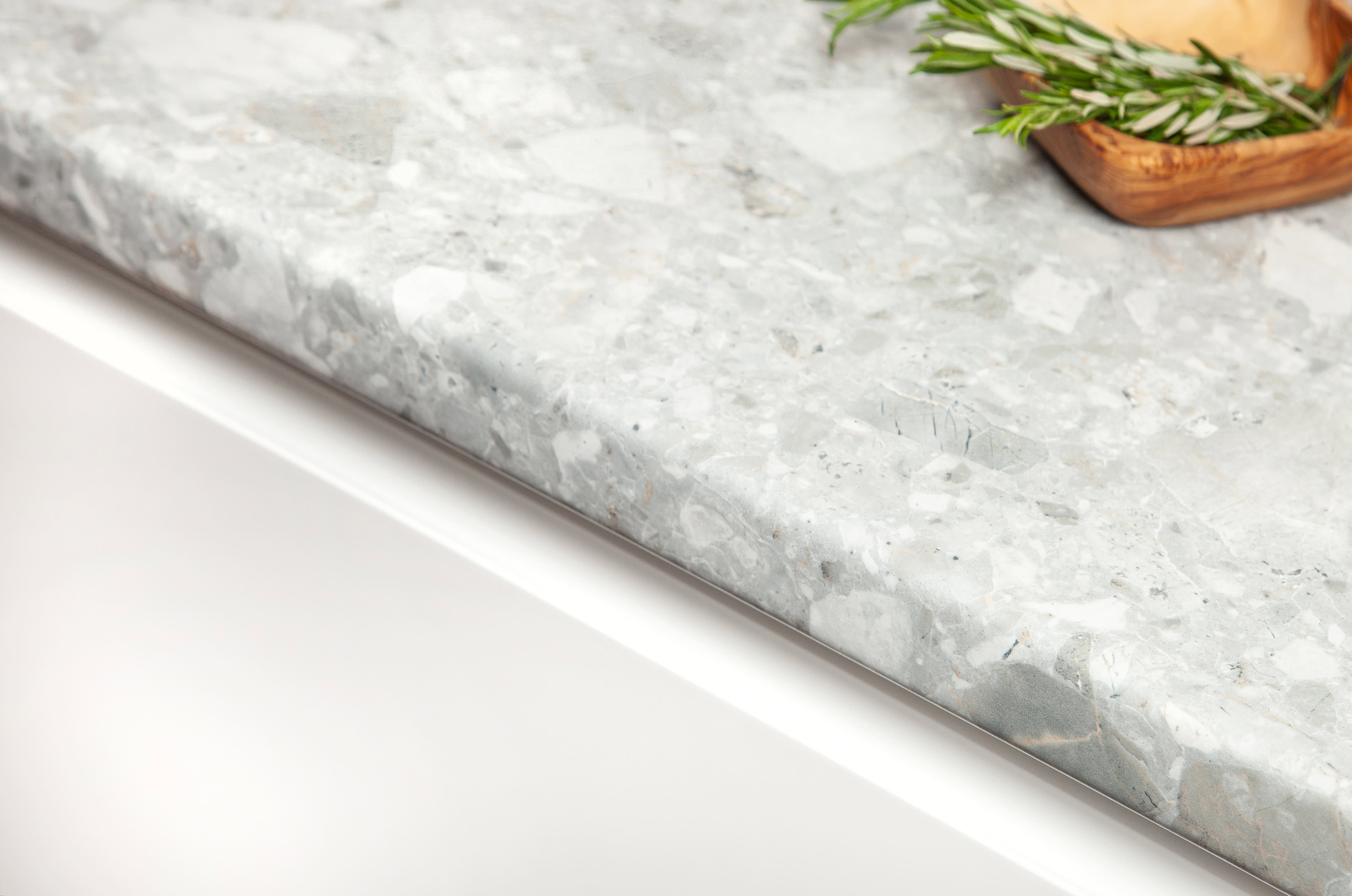 Trebbia Stone Worktop Edge with fresh rosemary on worktop