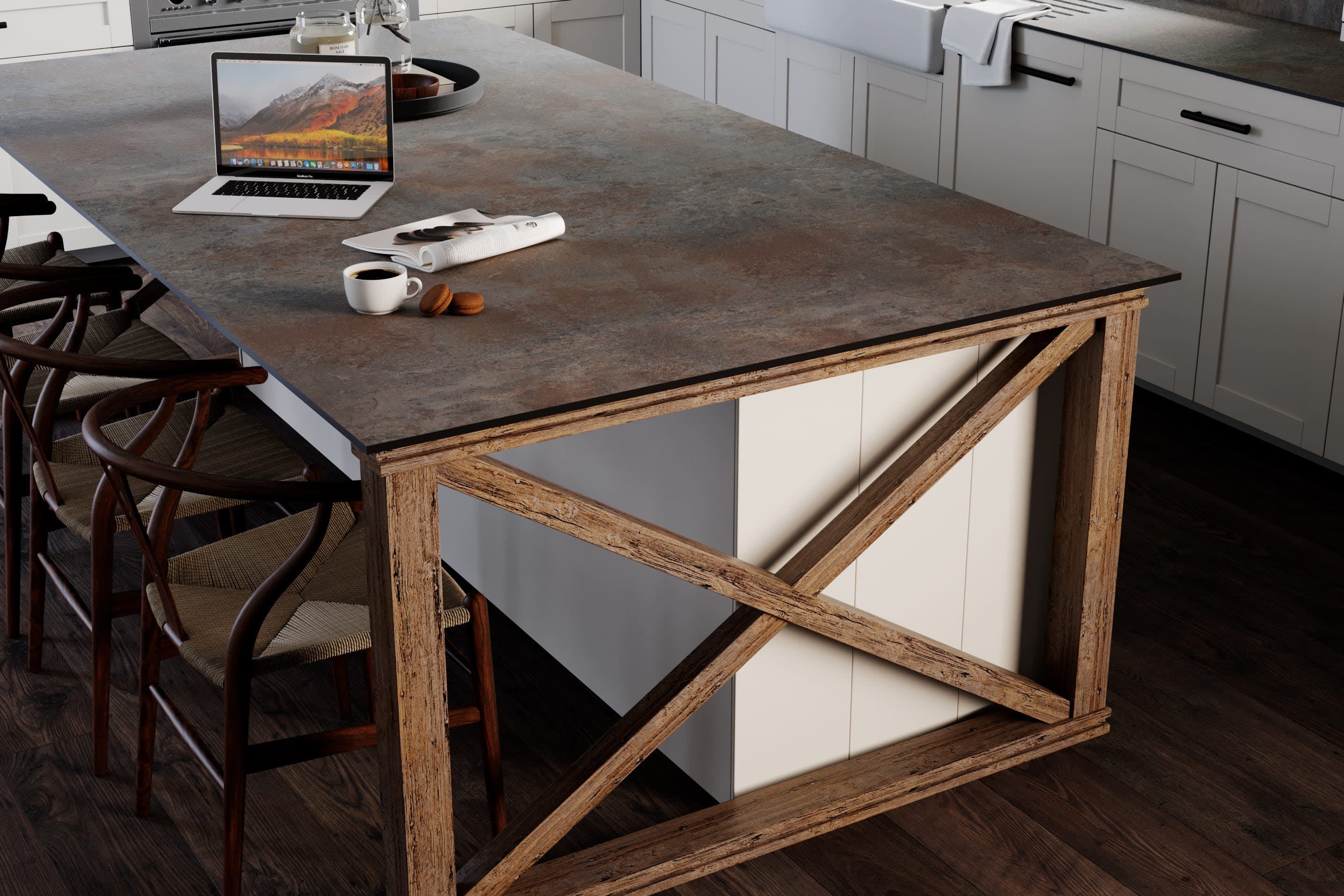 Iron Ore solid laminate surface on kitchen island with bar with laptop and coffee cup on top