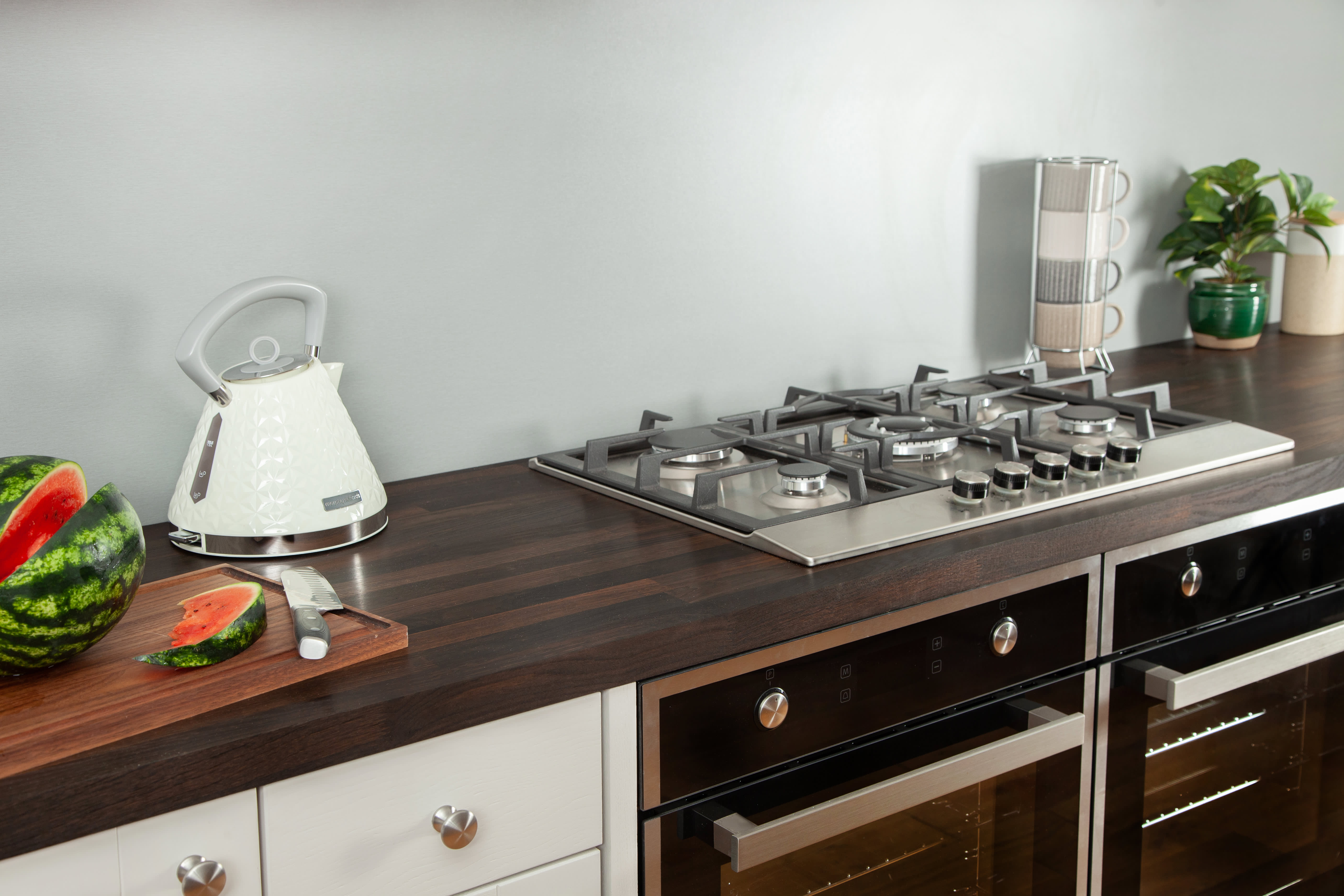 Black Oak Wooden Worktop in kitchen with double over and hob