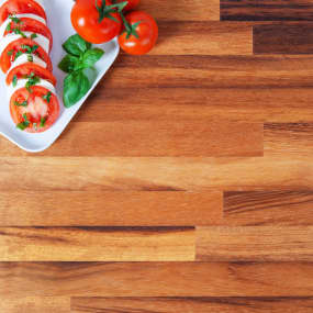 Iroko wooden kitchen worktop swatch with tomato salad