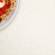 White quartz laminate worktop swatch with sourdough pizza