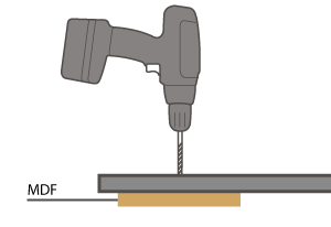 To prevent flaking when drilling, use a sacrificial piece of MDF on the underside of the hole.