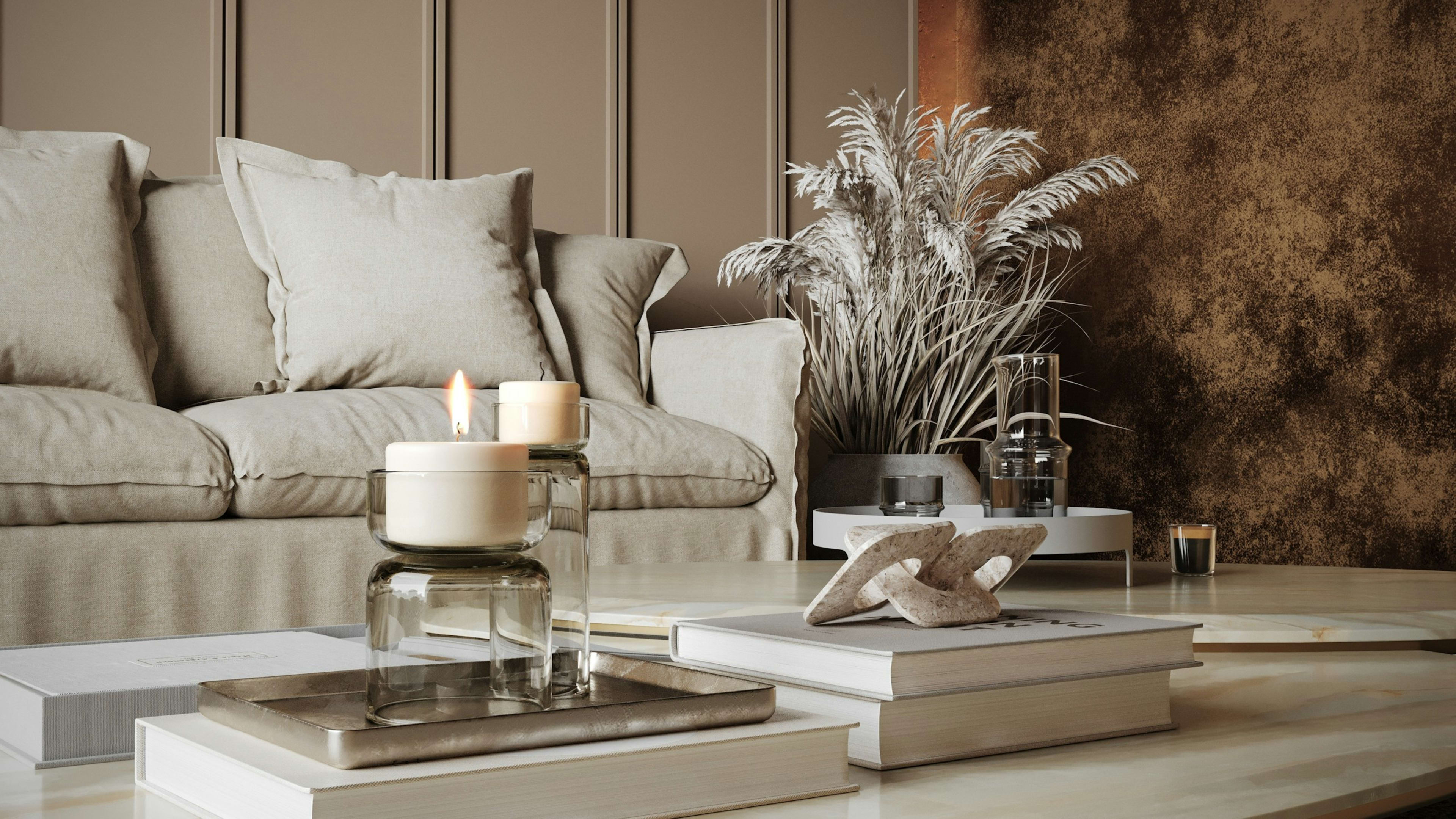 A calm living room with candles, linen cushions and pampas grass