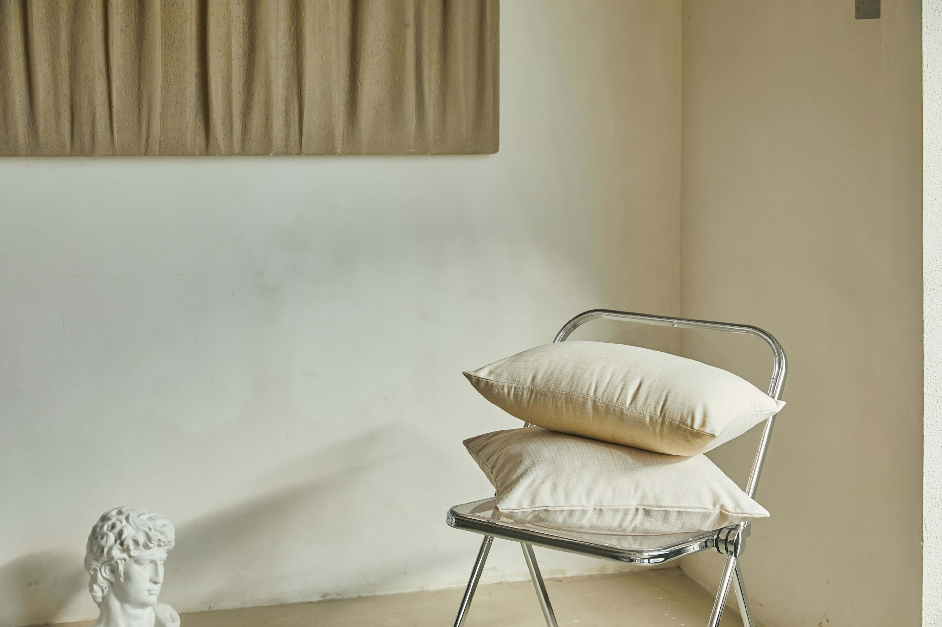 Linen cushions on a wooden chair