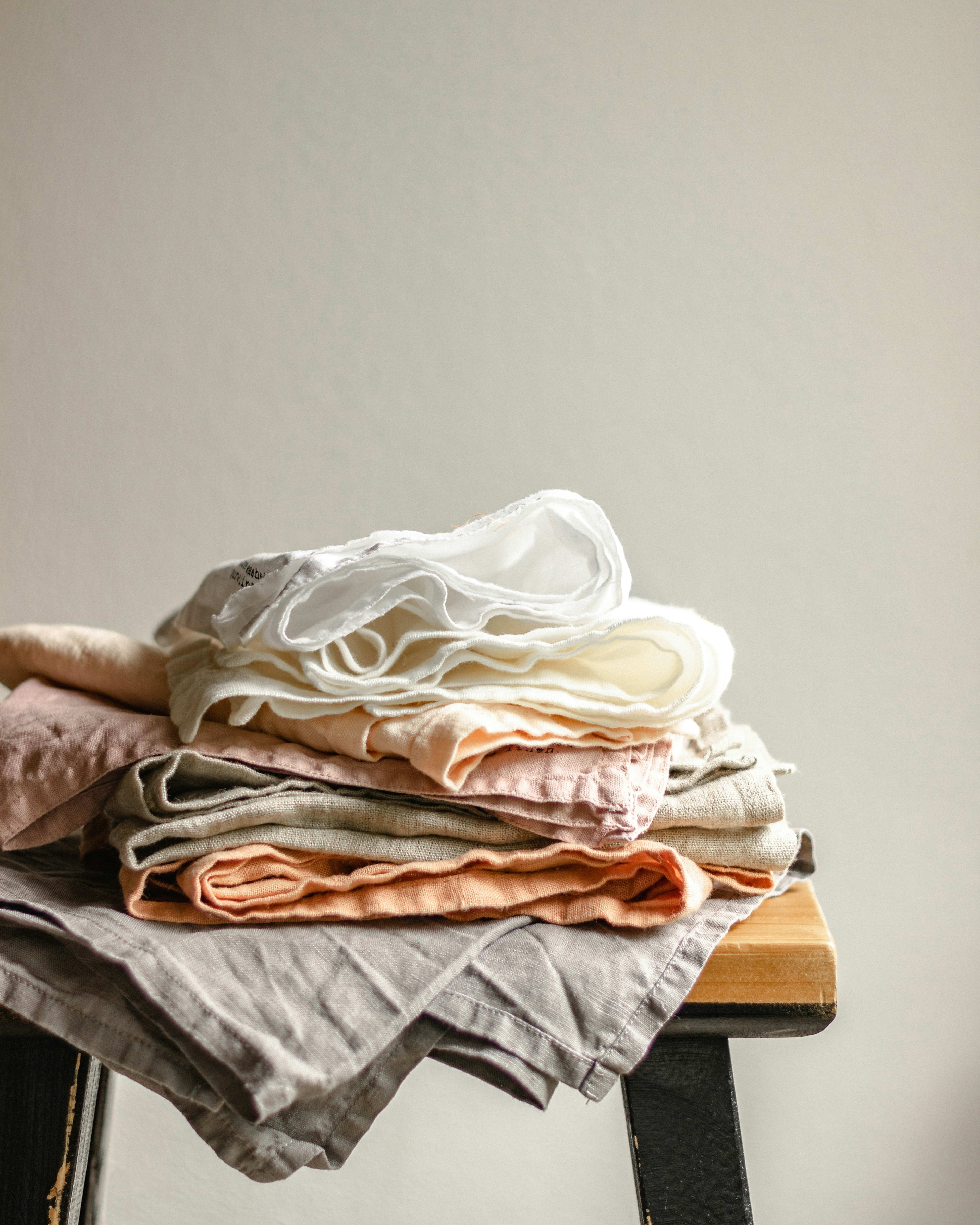 Folded linens in soft pastel tones