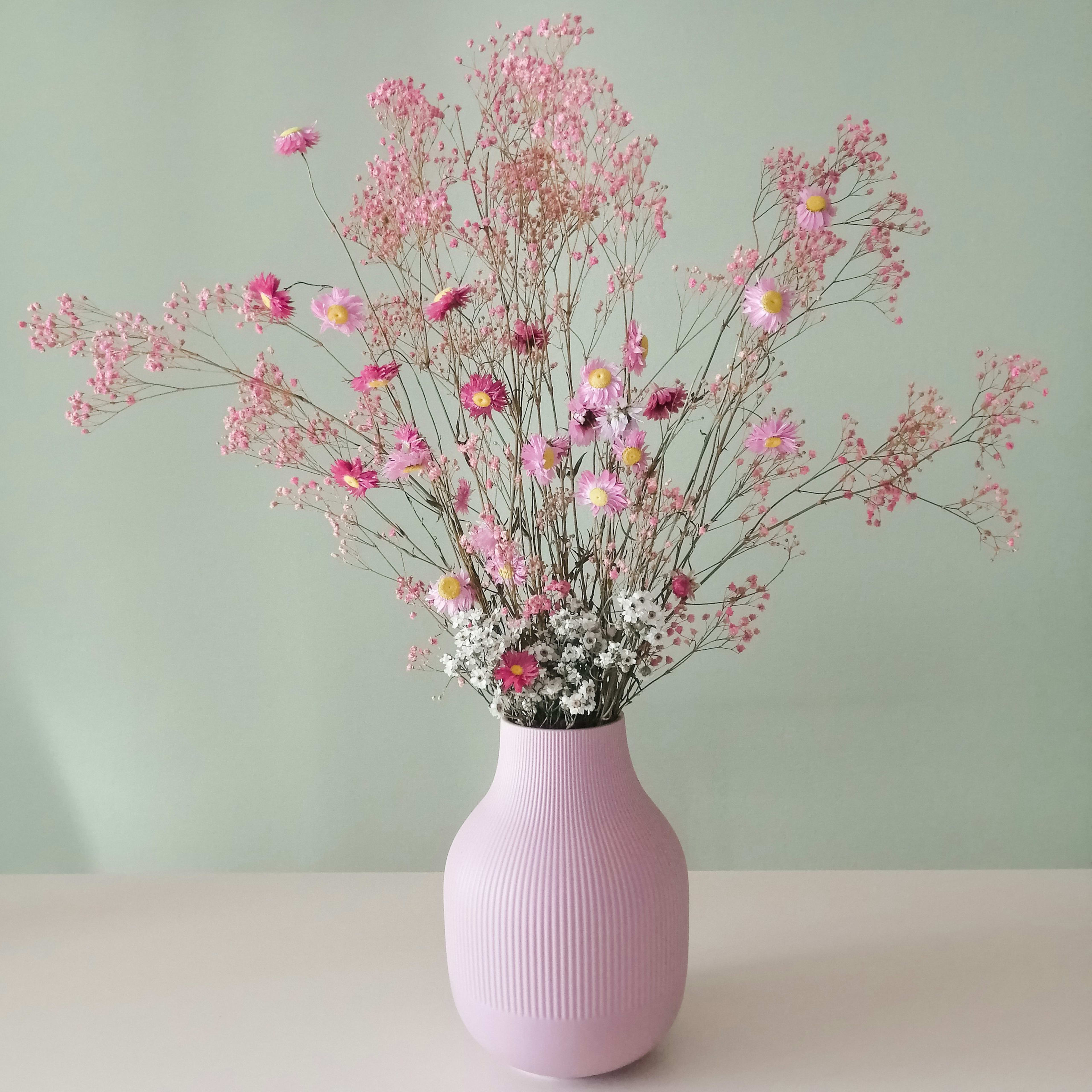 Blush dried flowers in a ceramic vase