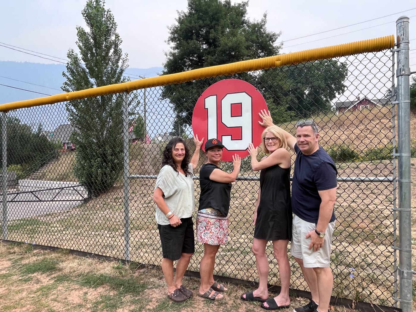 Friends and family beside Amanda Asay’s commemorative number 19 at Queen Elizabeth Park