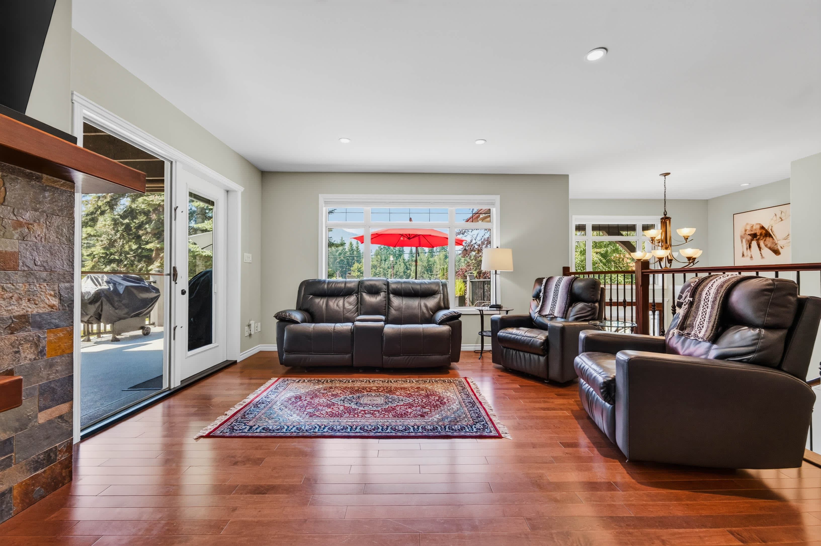 Bright living room opening to the covered deck