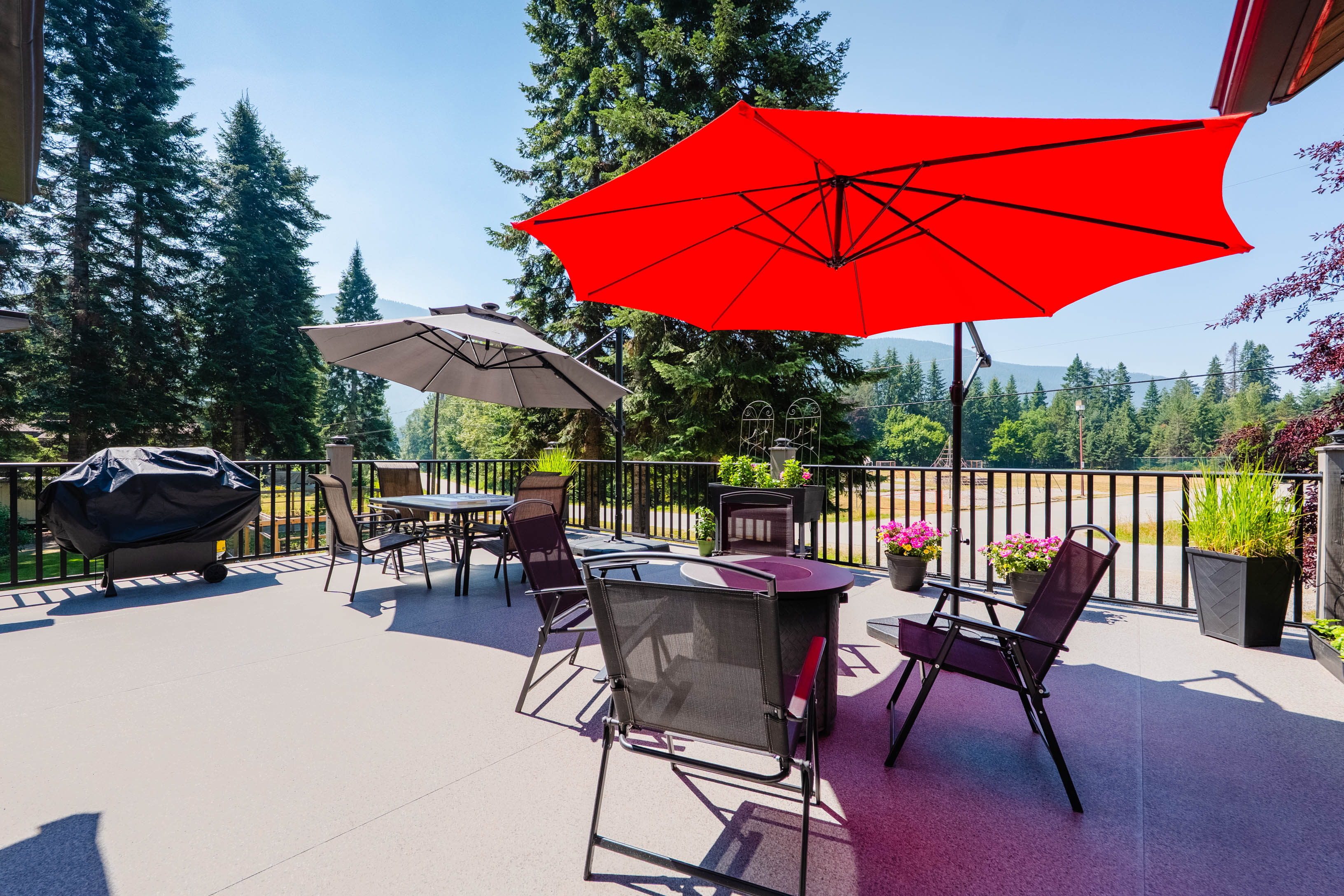 Sunny open deck with outdoor dining space