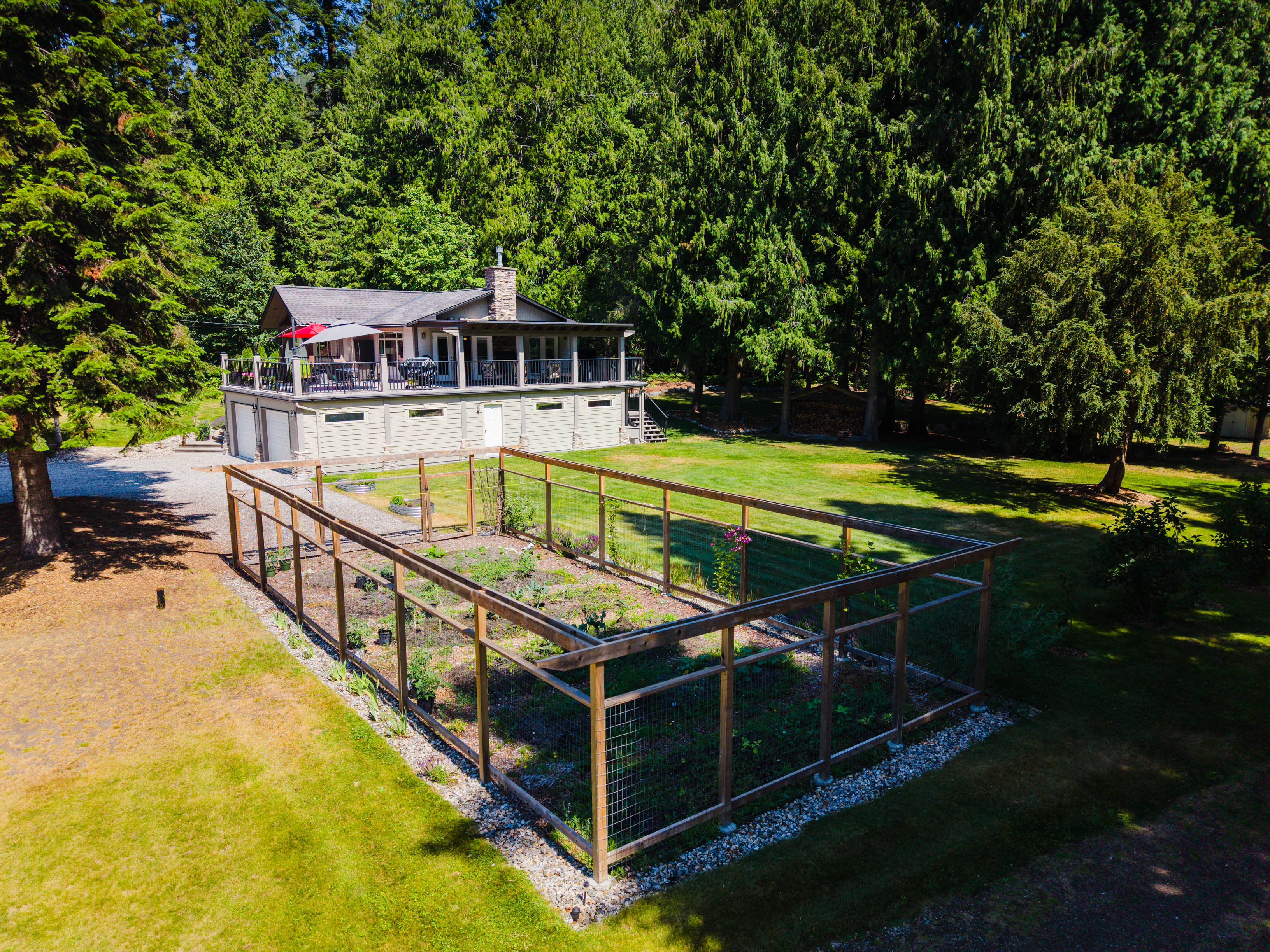 Aerial view of the fenced garden and level lawn