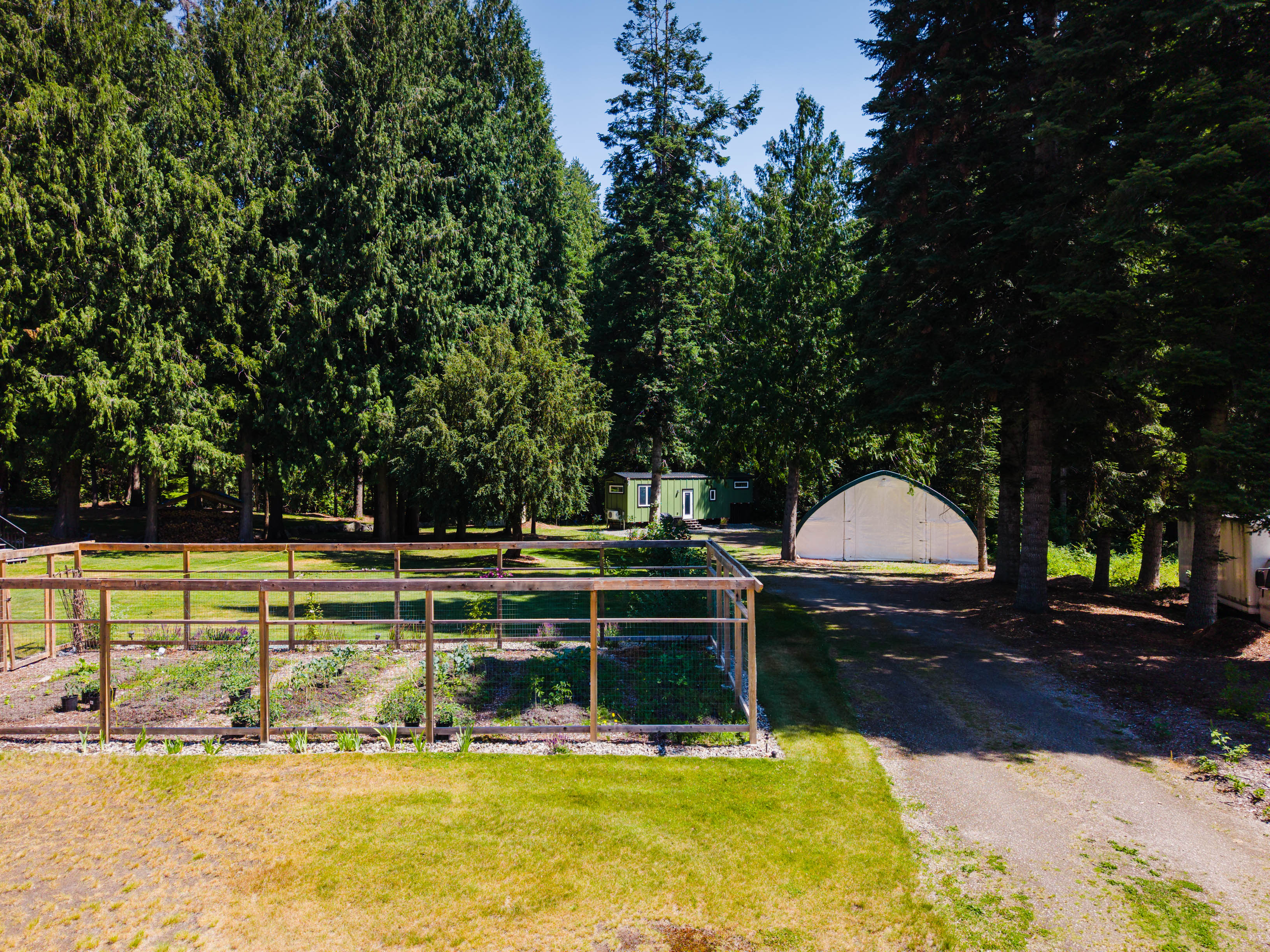 Garden, driveway and large Quonset hut at 262 Bryan Road