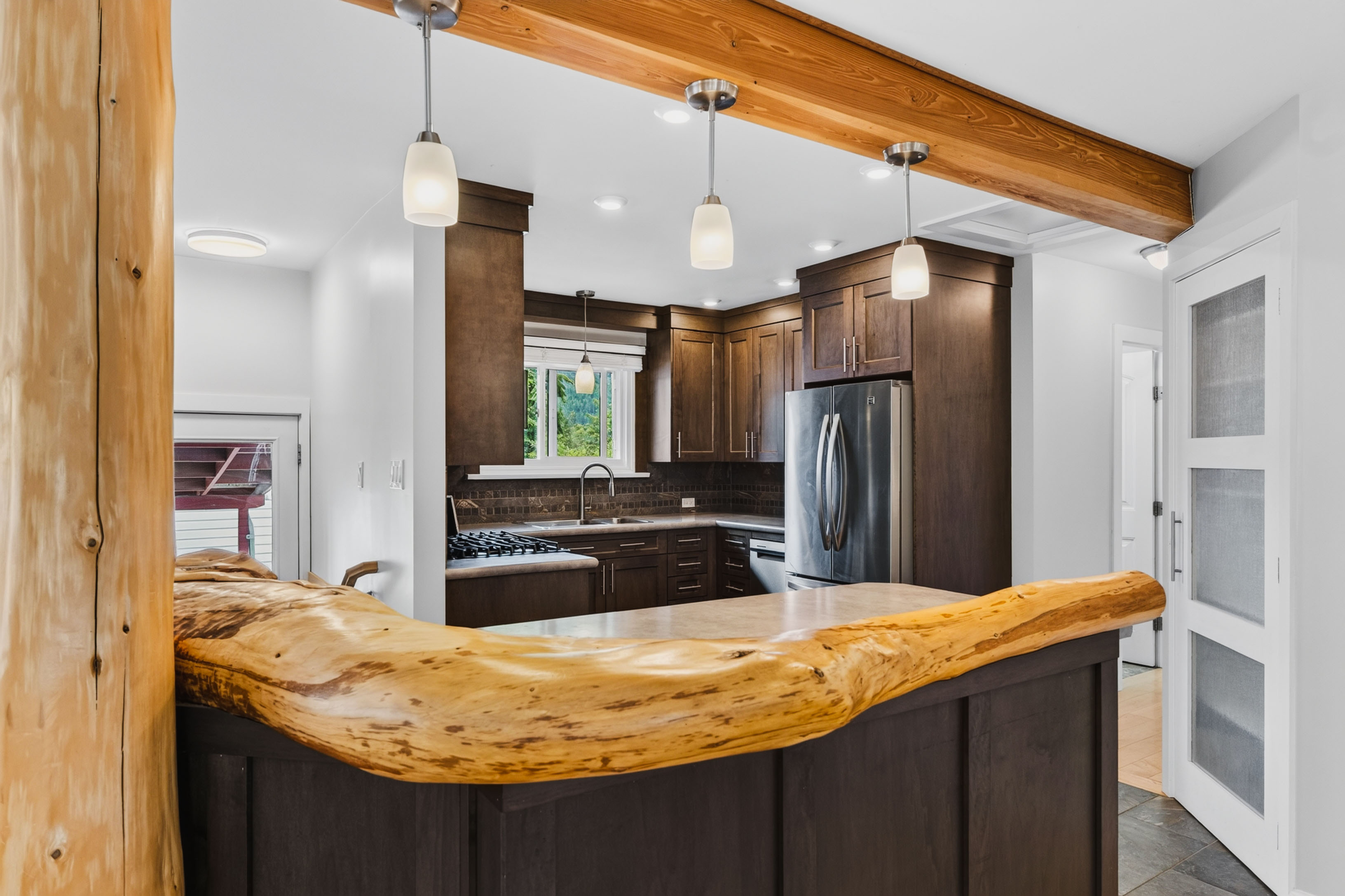 Kitchen with custom wood detail at 815 Tenth Street in Nelson BC