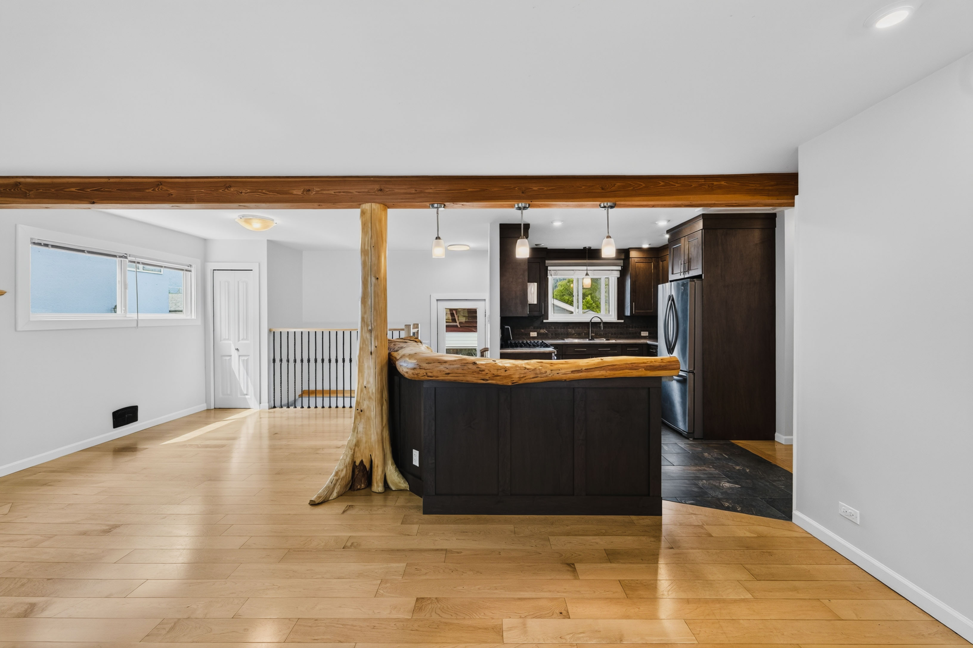 Kitchen and living flow at 815 Tenth Street in Nelson BC