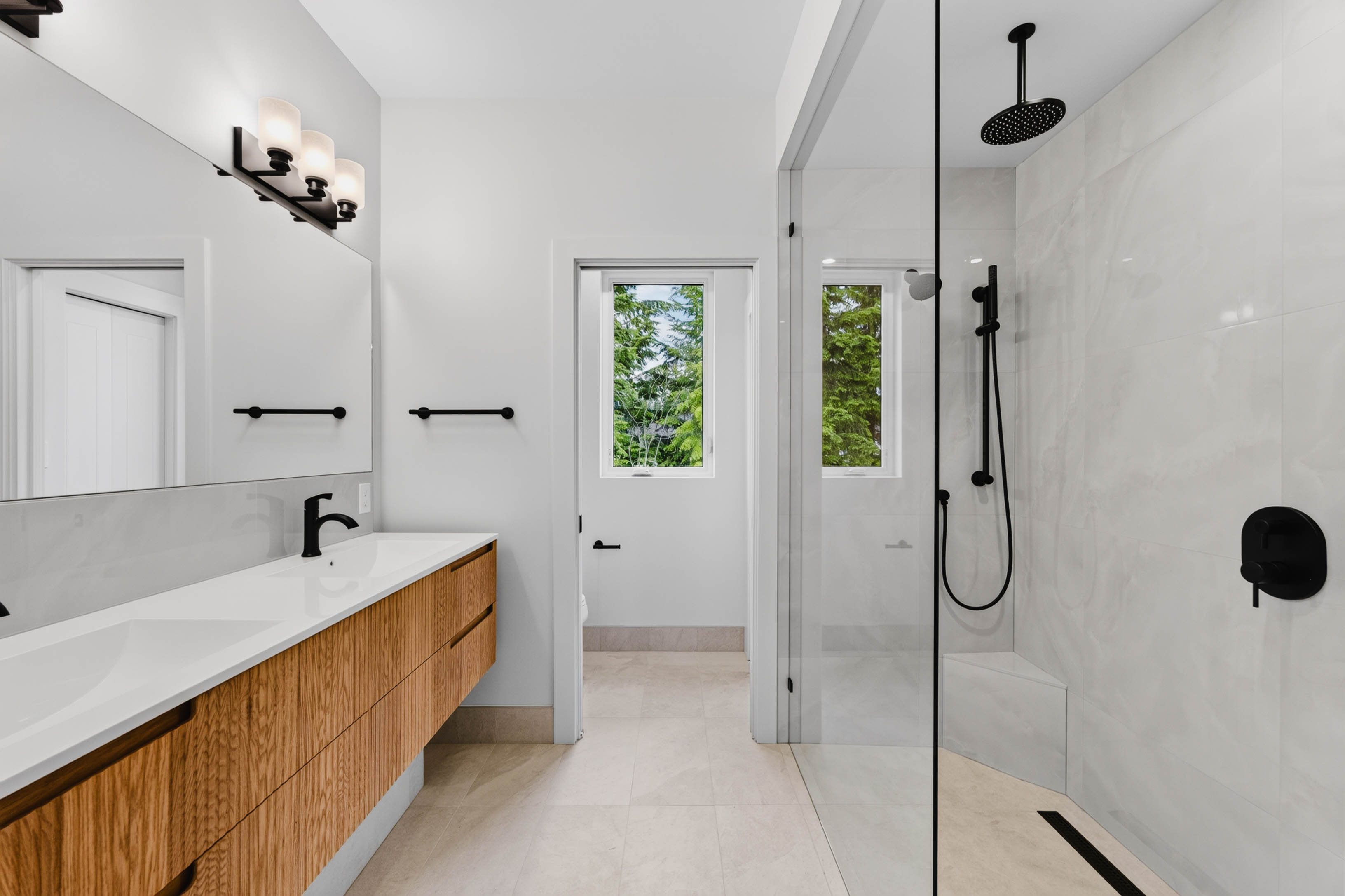 Ensuite bathroom at 7769 Holt Road with accessible shower and modern finishes