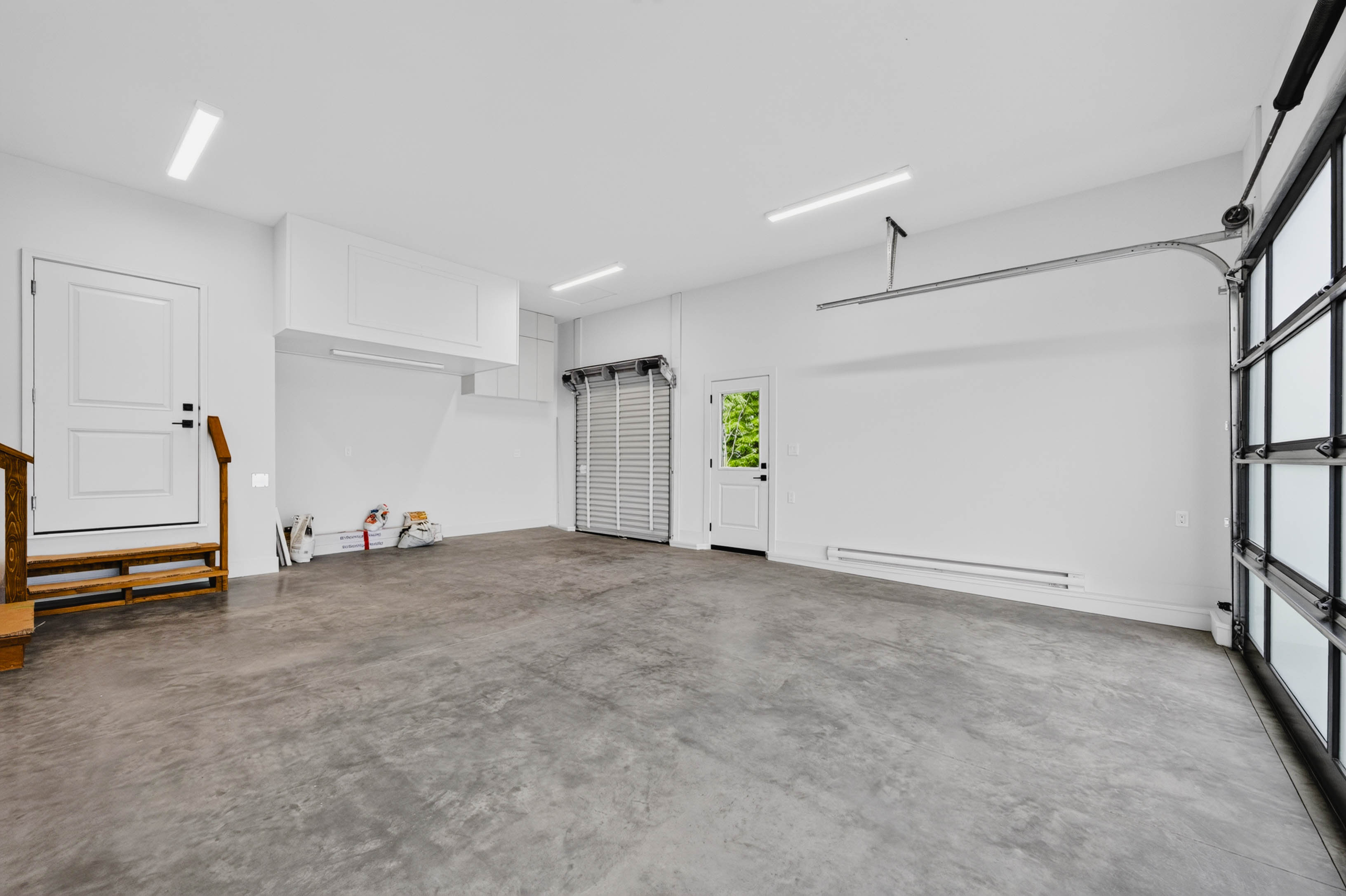 Double garage at 7769 Holt Road with bright interior and practical access
