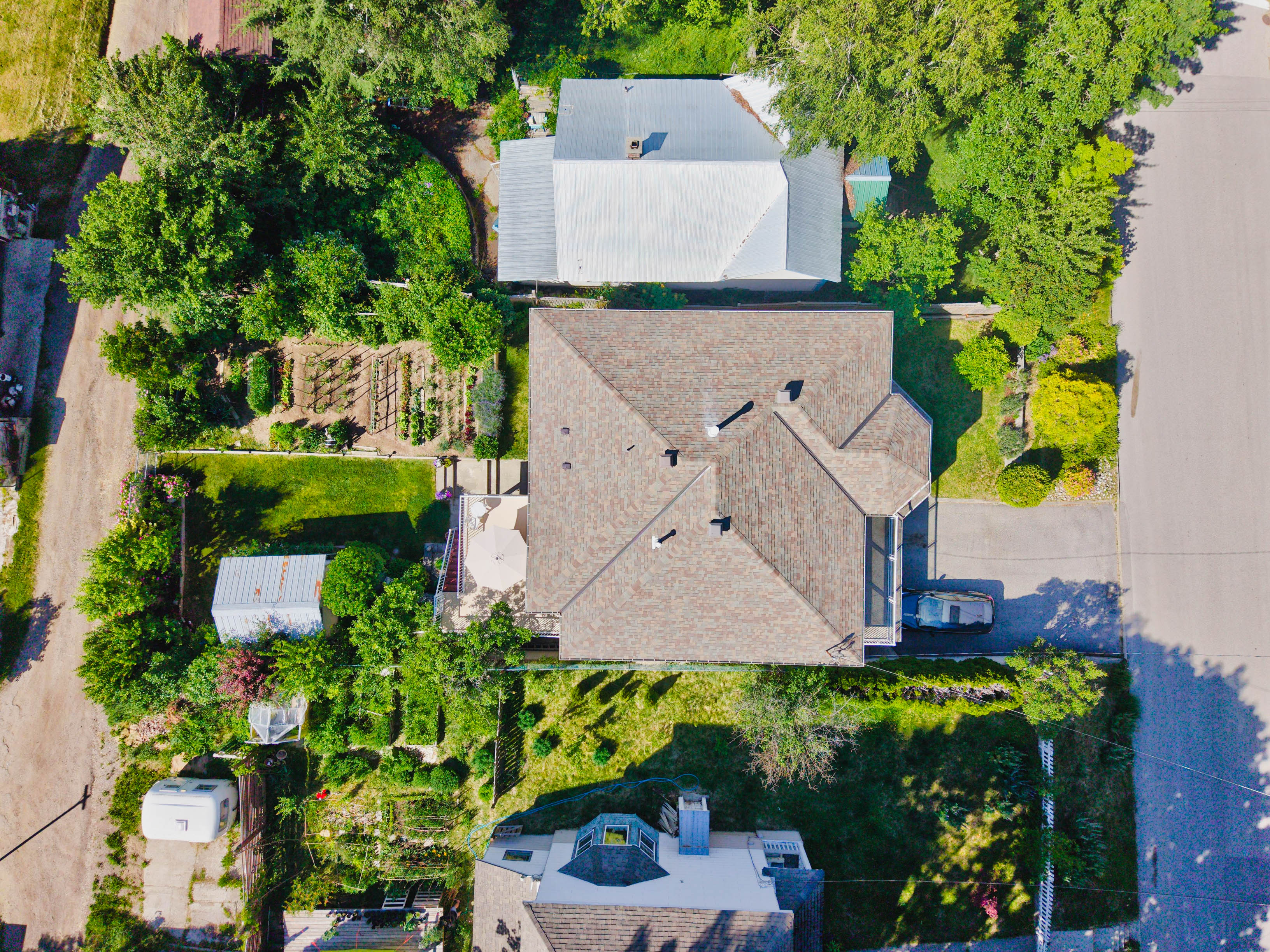 Aerial view showing the lot, gardens, and outdoor space