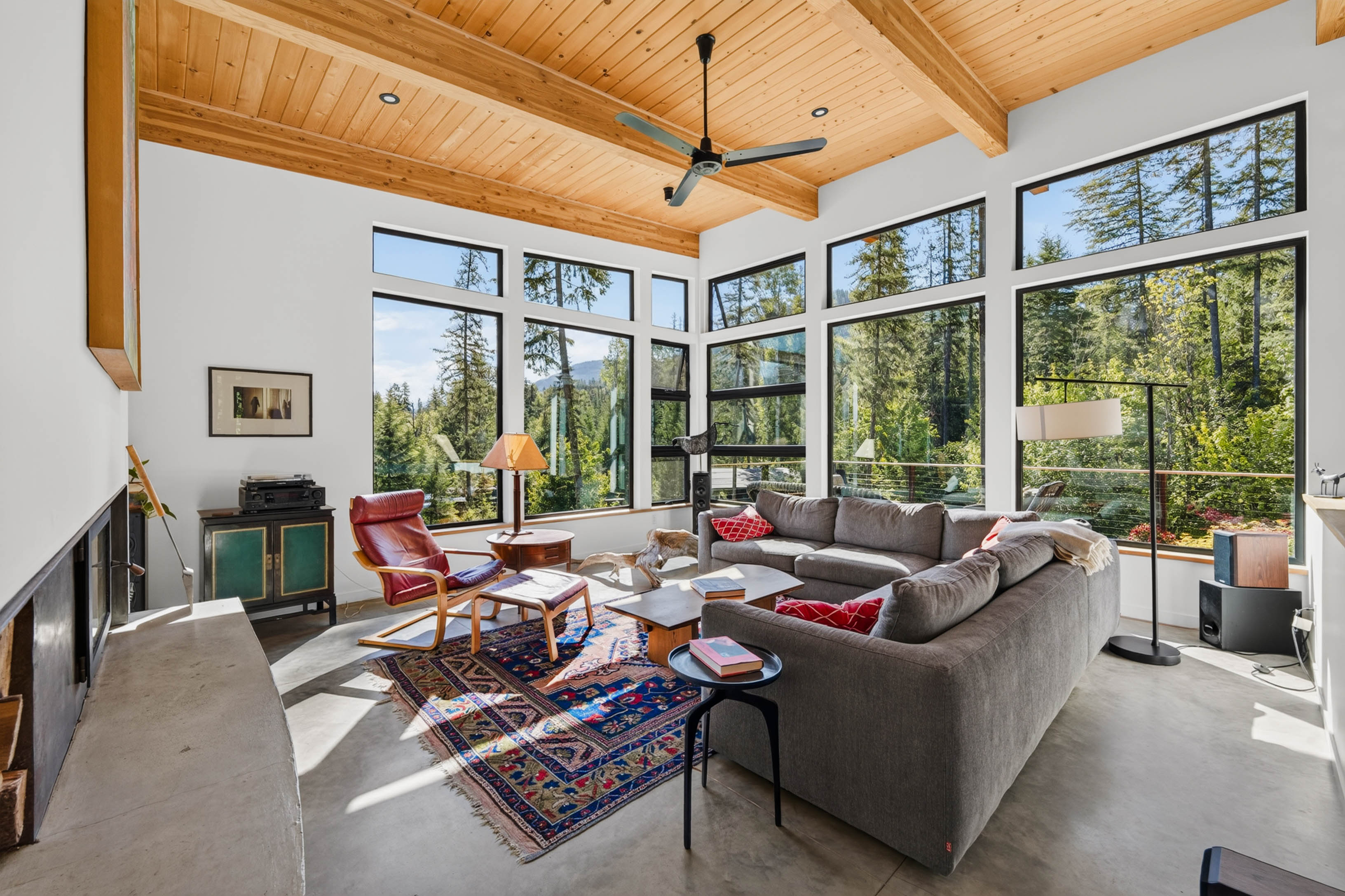 Living room with large windows and forest views at 4135 Kays Road