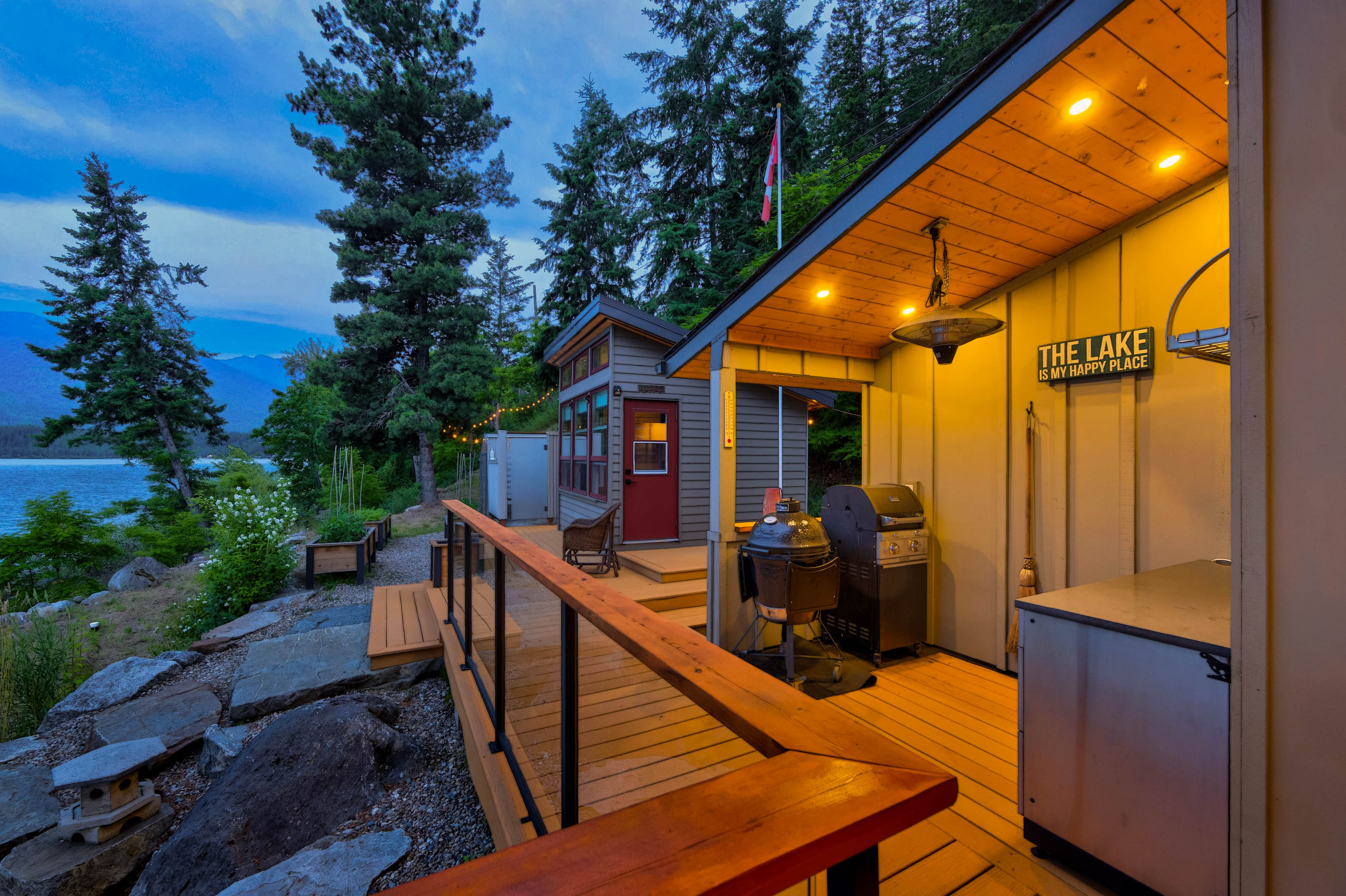Outdoor kitchen and deck at dusk