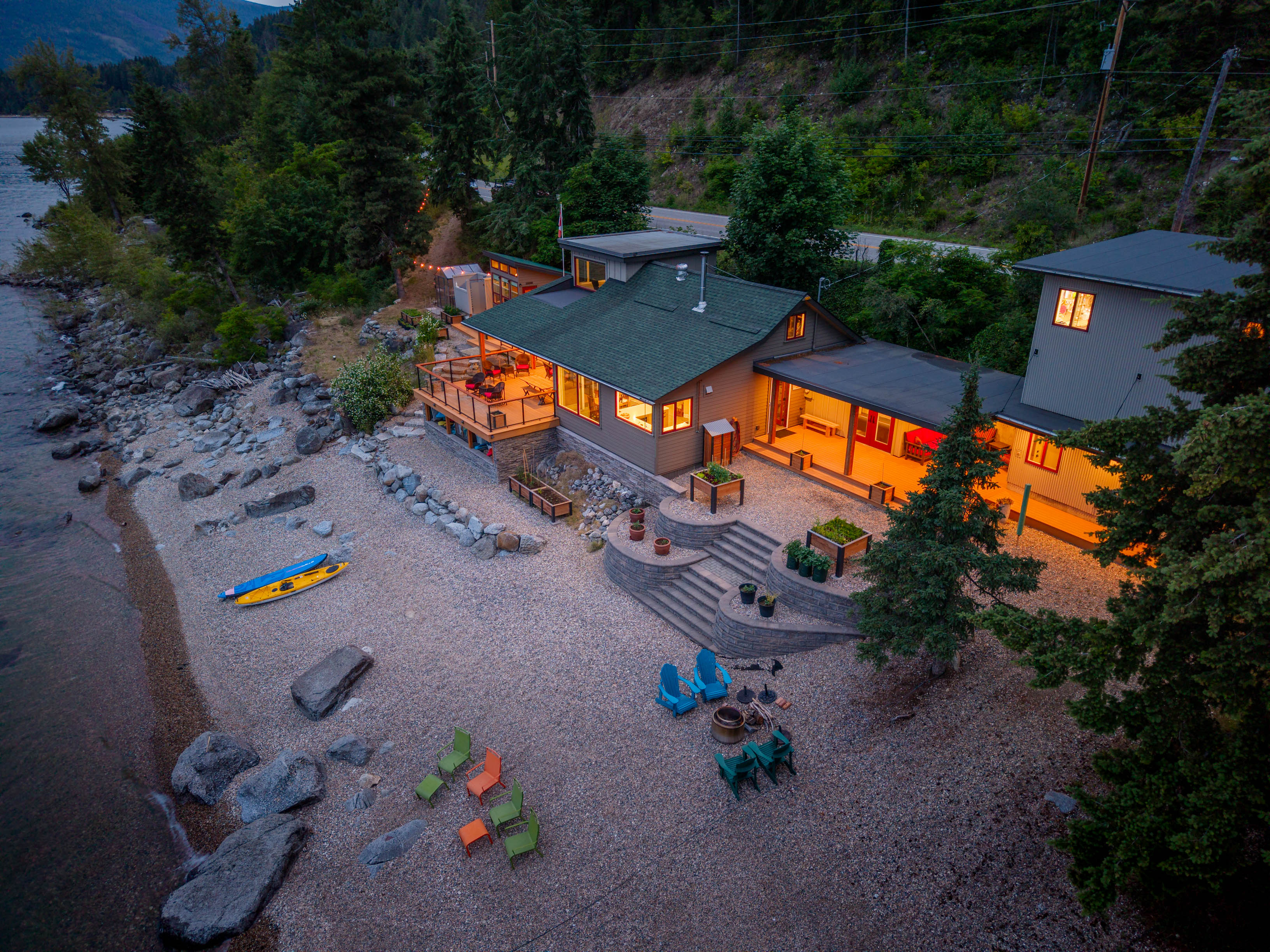 Twilight aerial of 1726 Highway 31 on Kootenay Lake