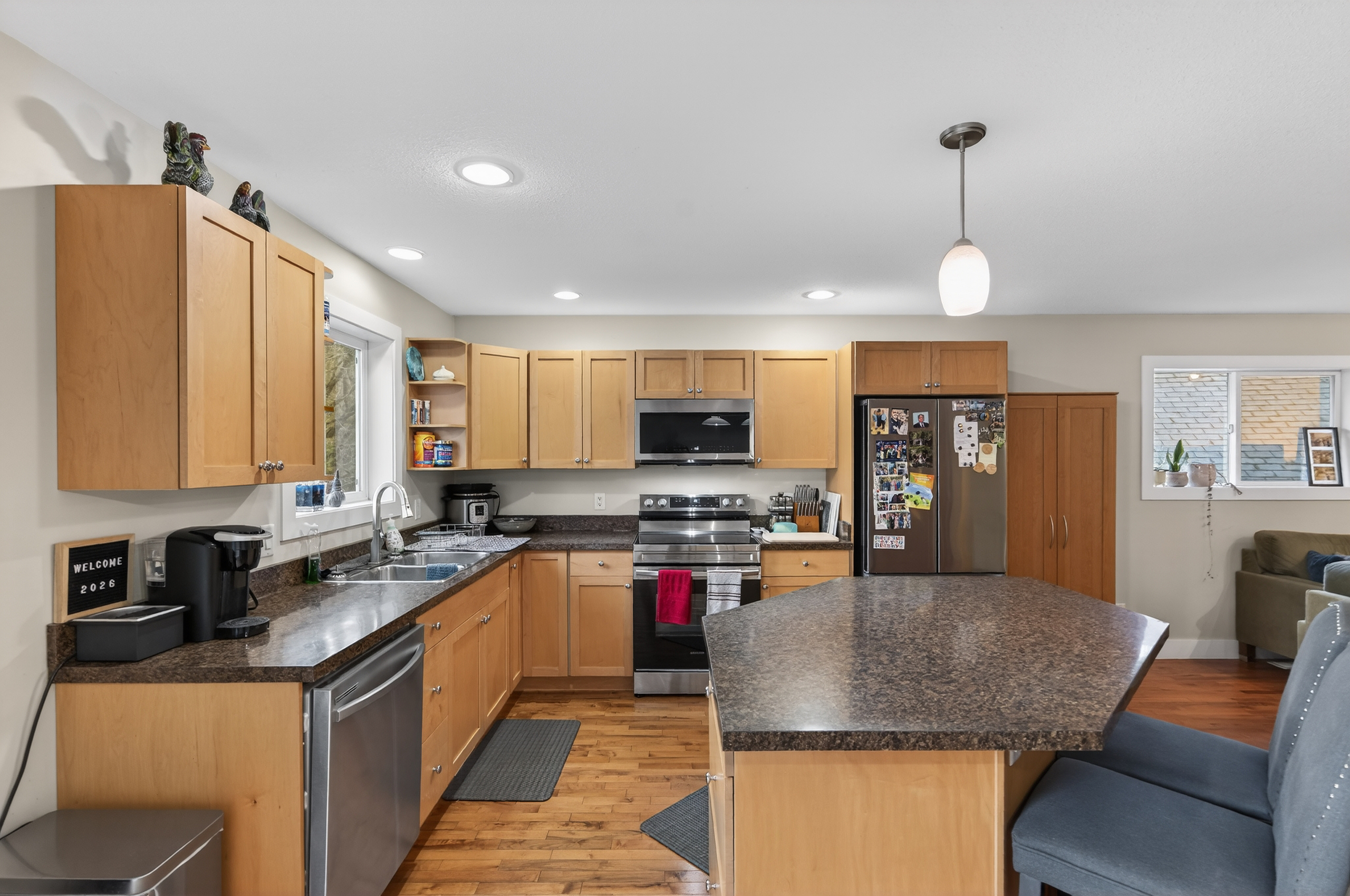 Kitchen with island and natural wood cabinetry