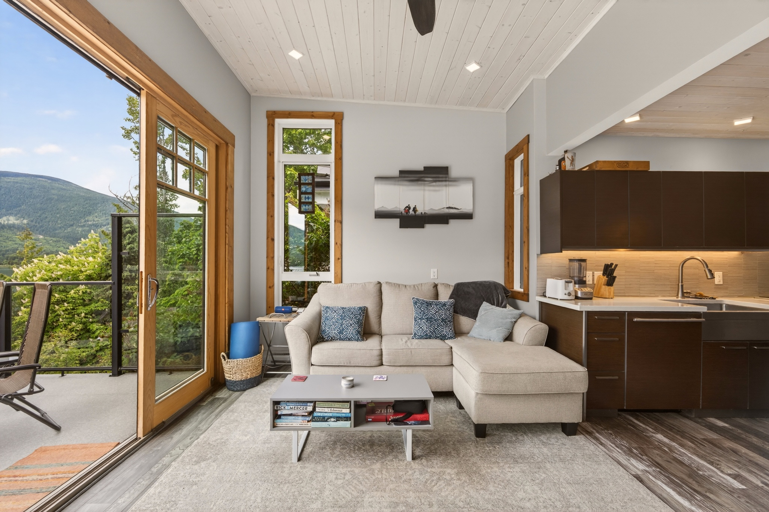 Open living area connected to the lake-facing deck