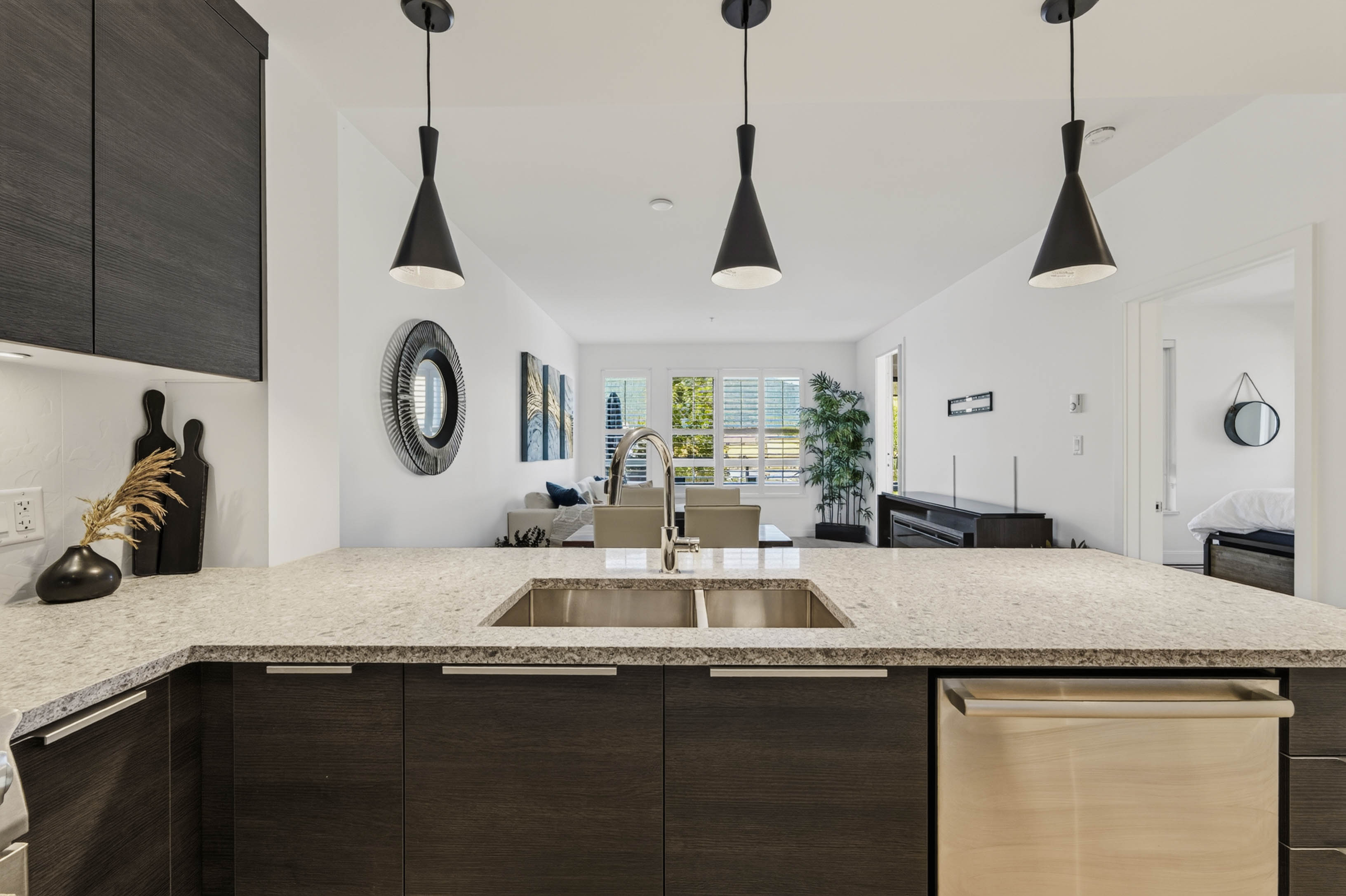 Kitchen island, sink and pendant lighting