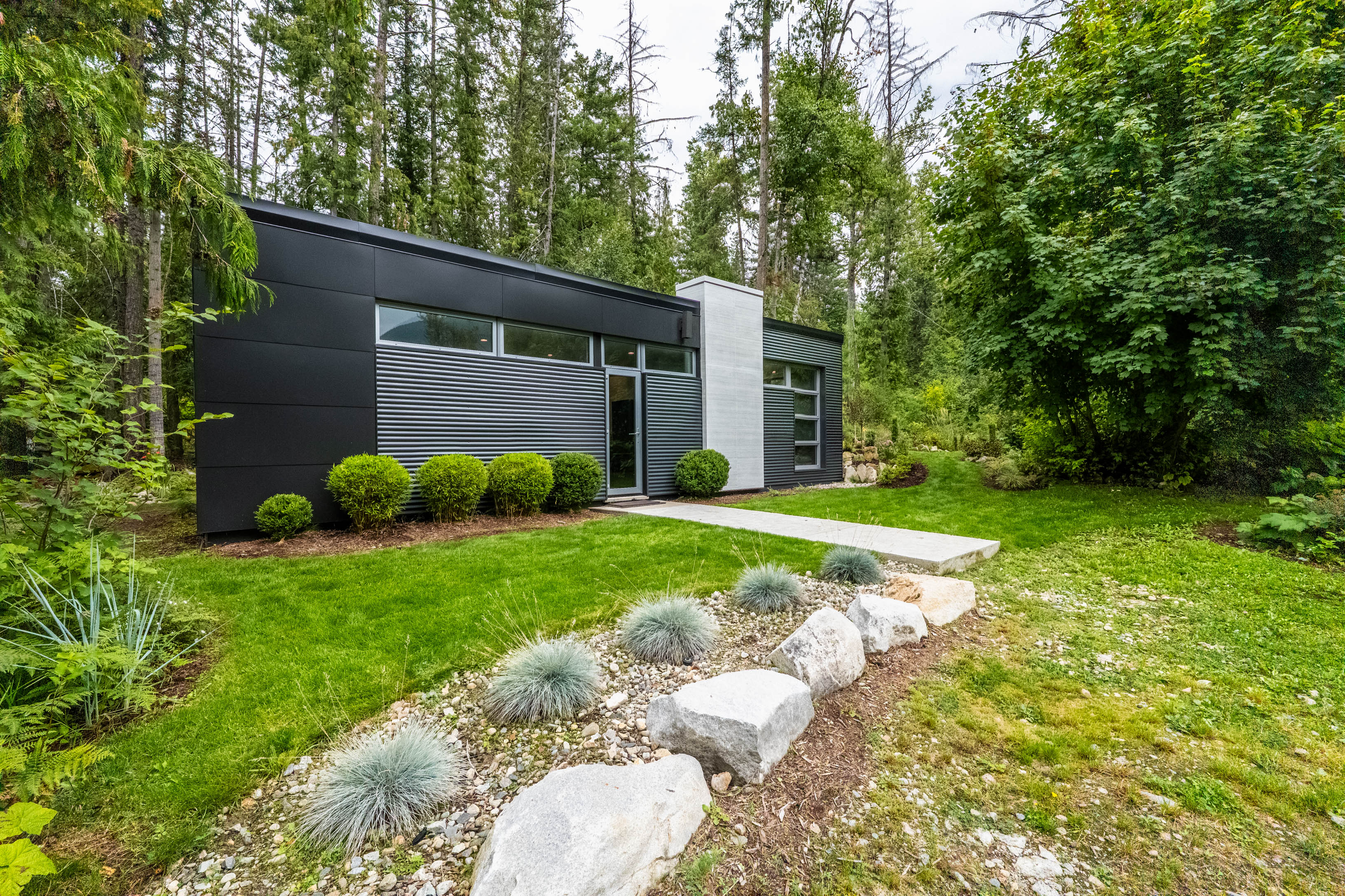Contemporary renovated home surrounded by forest at 183–191 Kootenay Lake Road