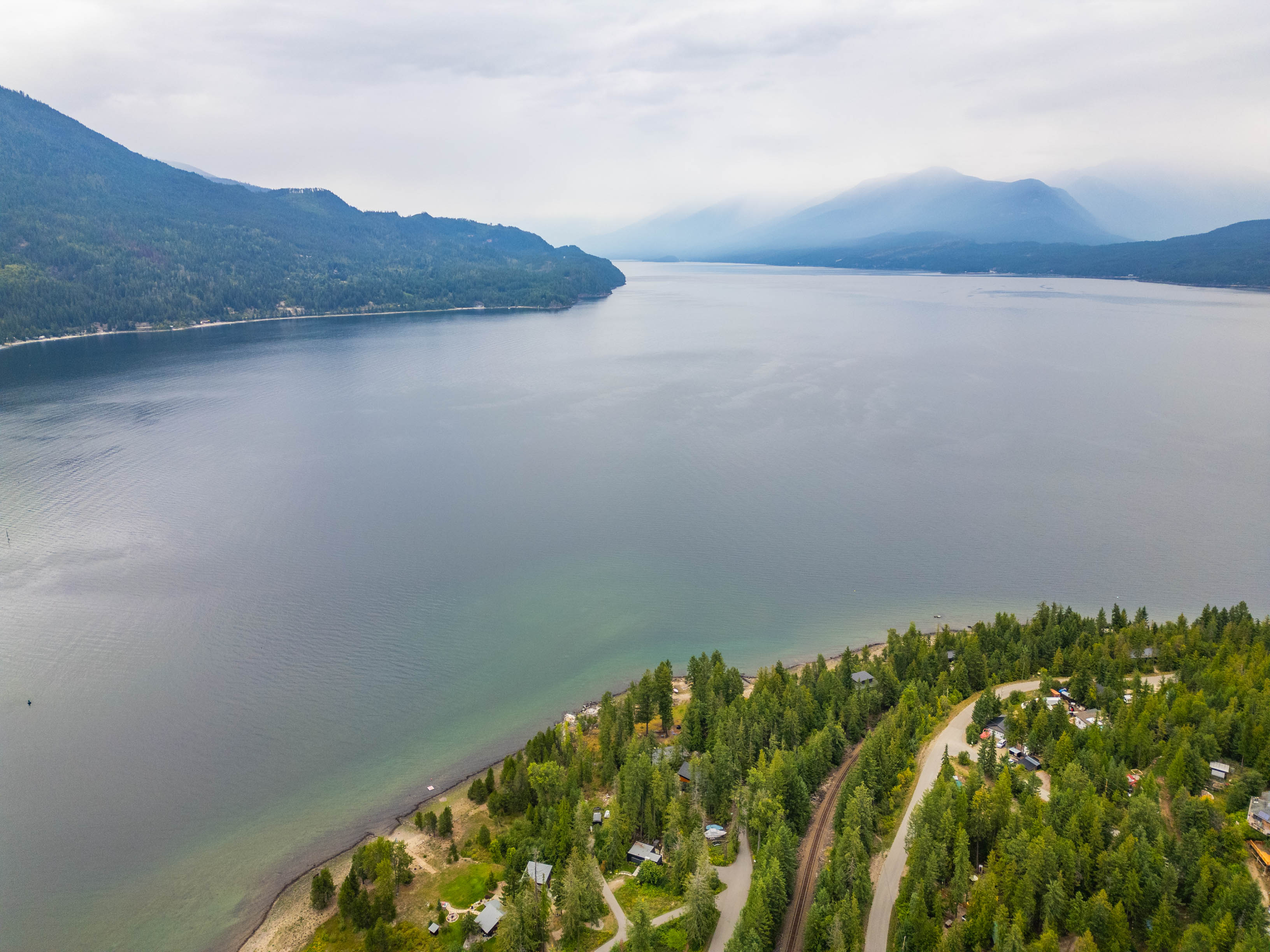 Kootenay Lake stretching toward mountain ranges near Procter, British Columbia