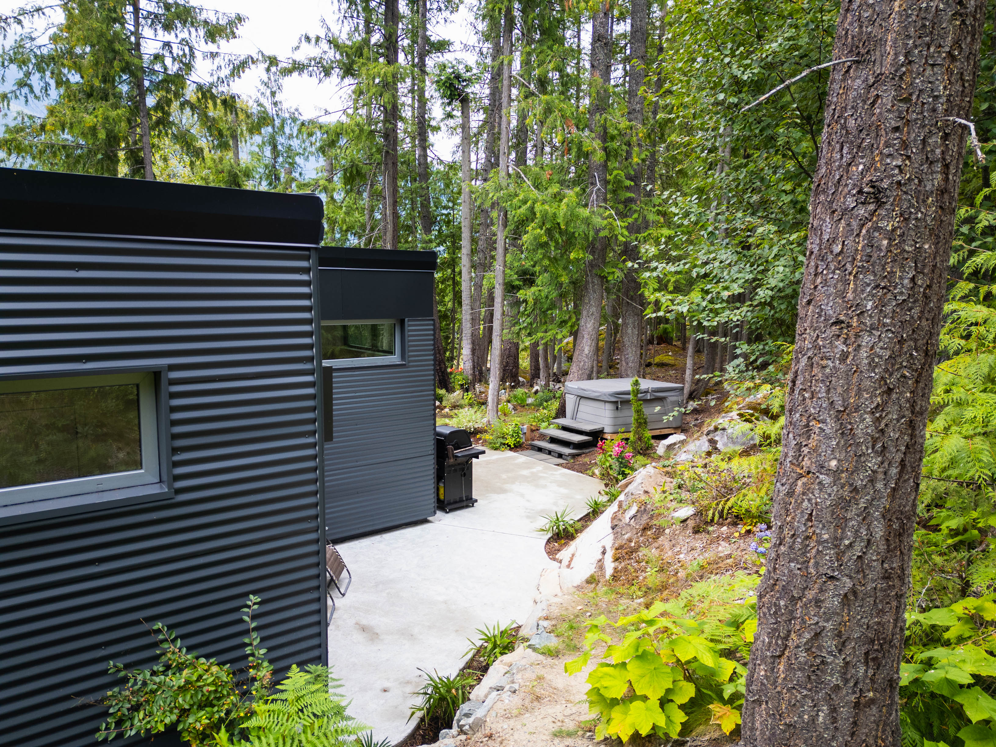 Private hot tub tucked among mature trees