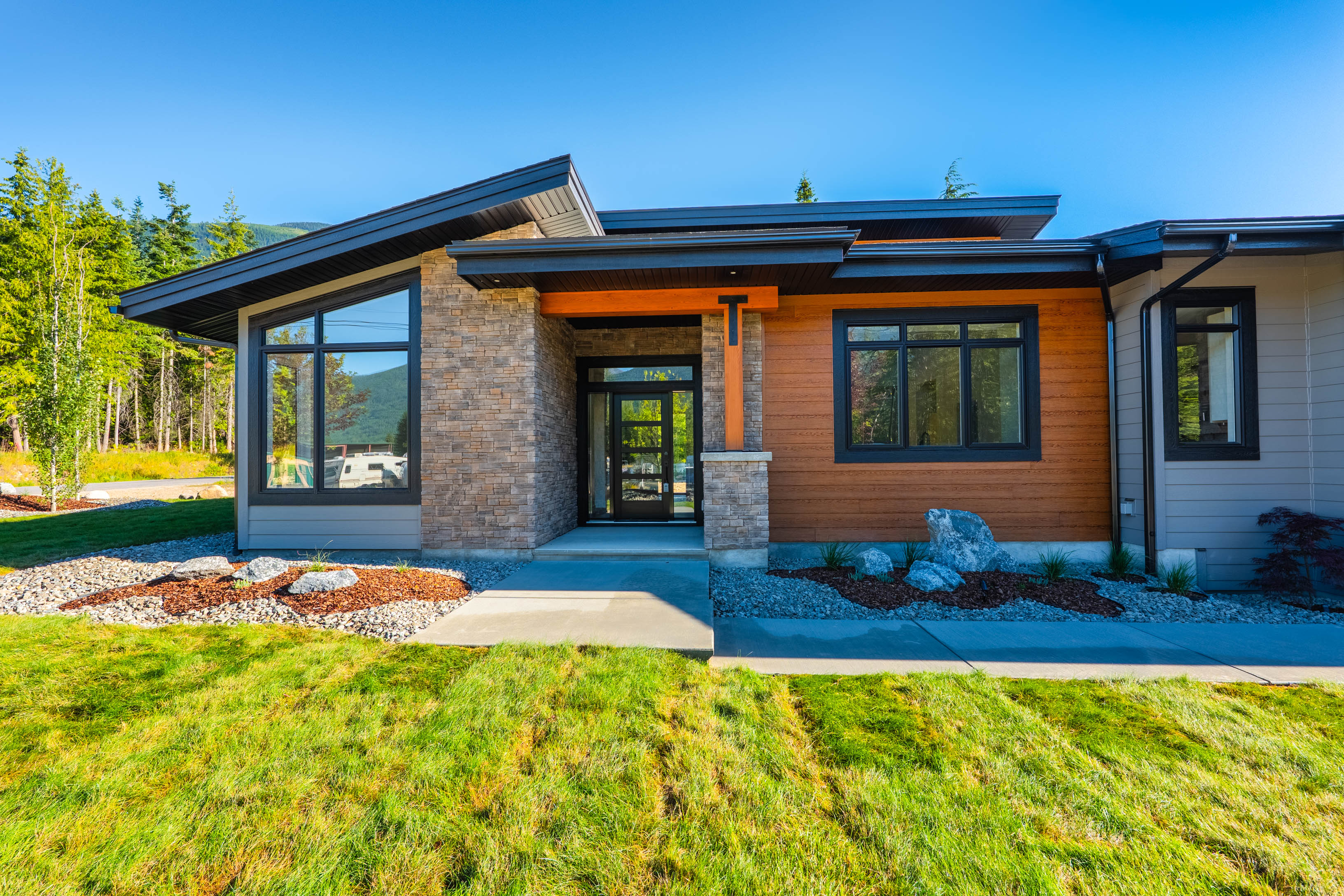 Updated front entry and exterior of 7769 Holt Road in Balfour BC