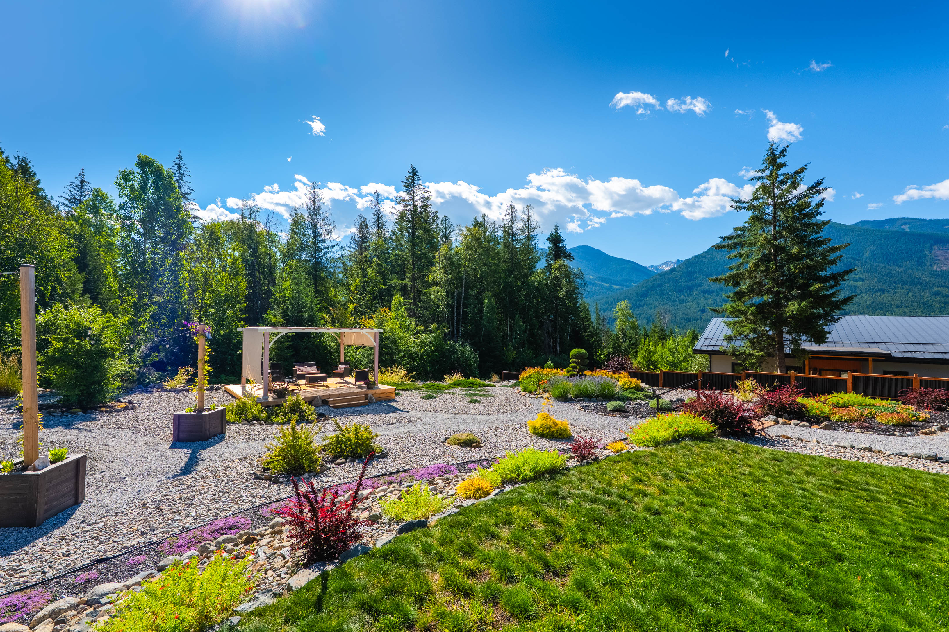 Pergola lounge and landscaped garden at 430 Buriview Drive with mountain views